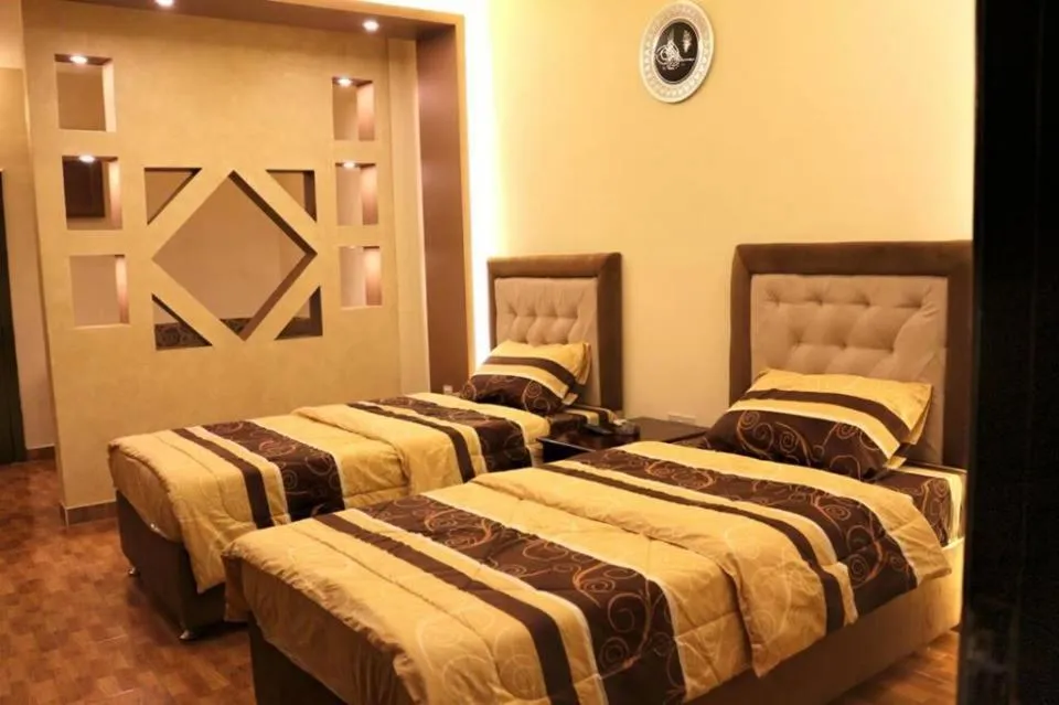 Bed in Al Riyati Hotel Apartments