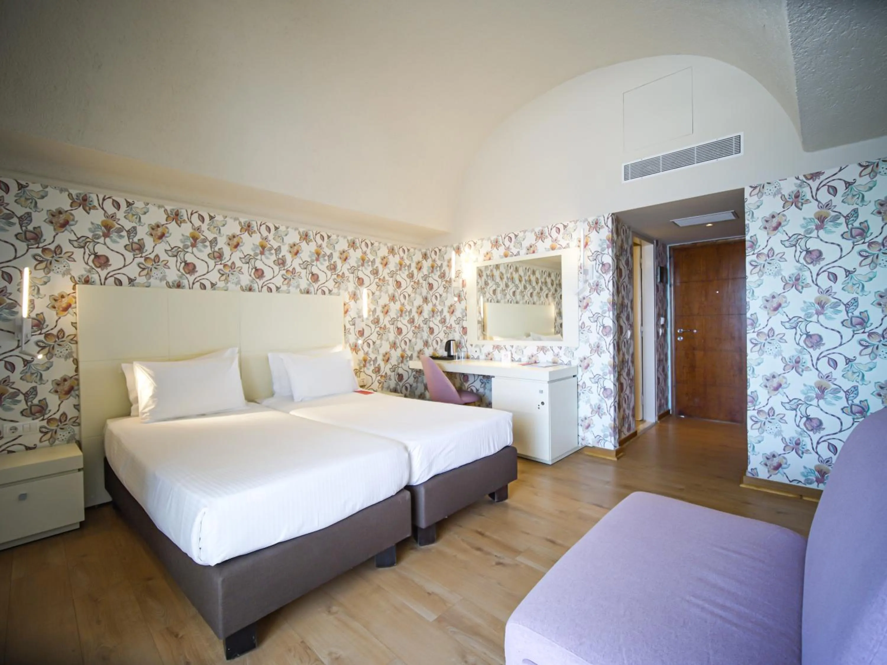 Bed in Ramada Loutraki Poseidon Resort