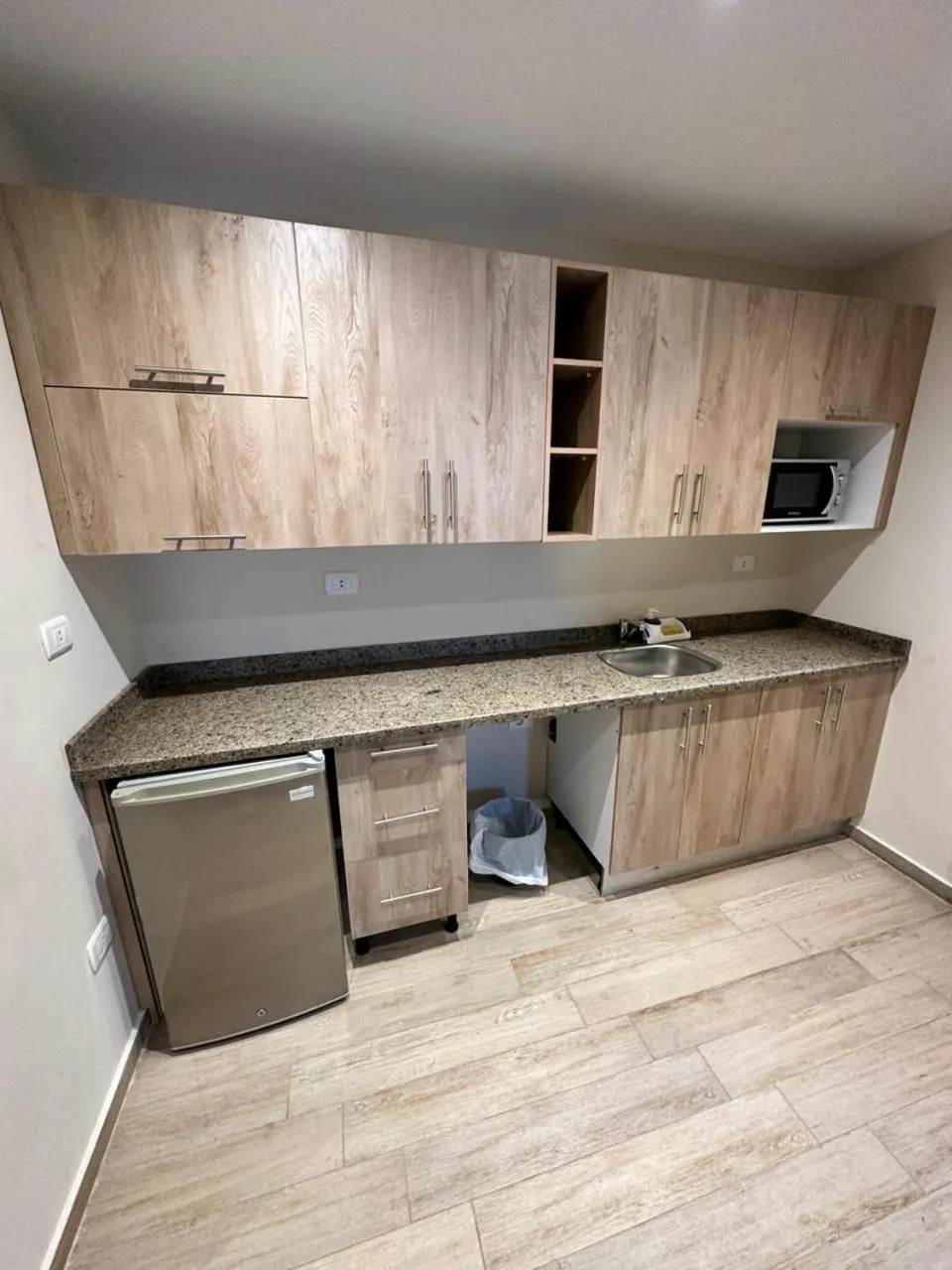 Kitchen or kitchenette in Nakhil Inn Residence