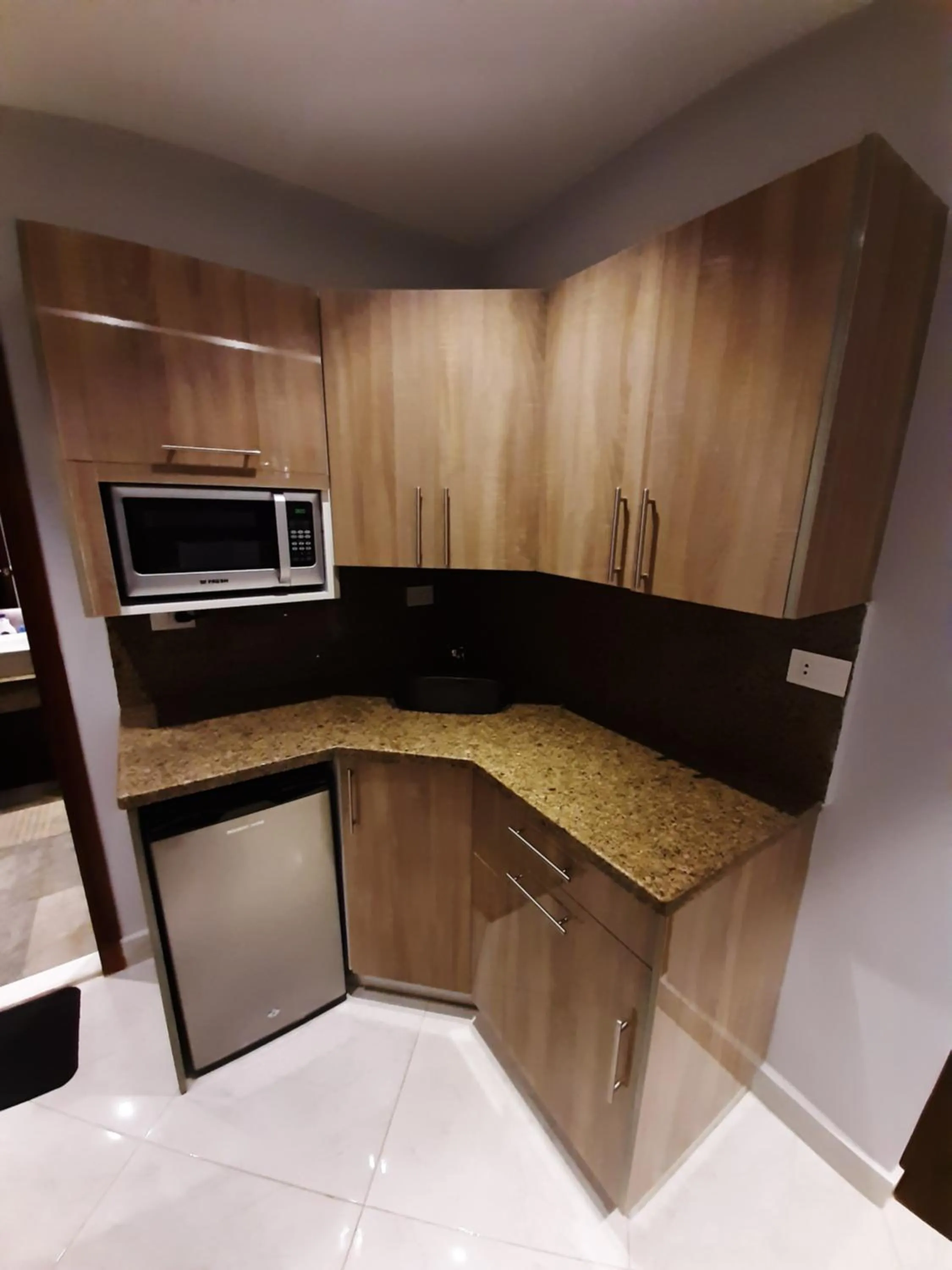 Kitchen or kitchenette in Nakhil Inn Residence