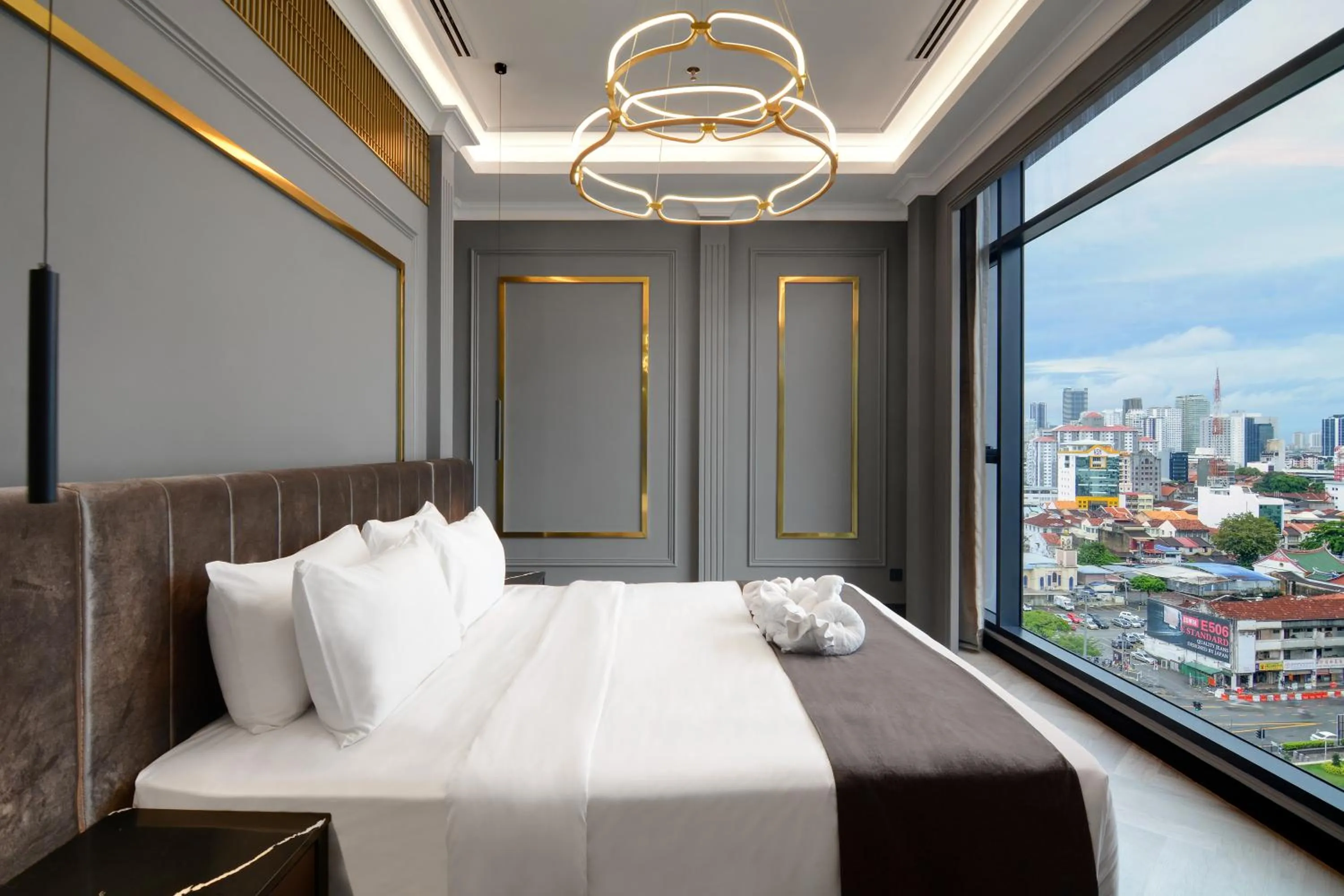 Bed in The Granite Luxury Hotel Penang