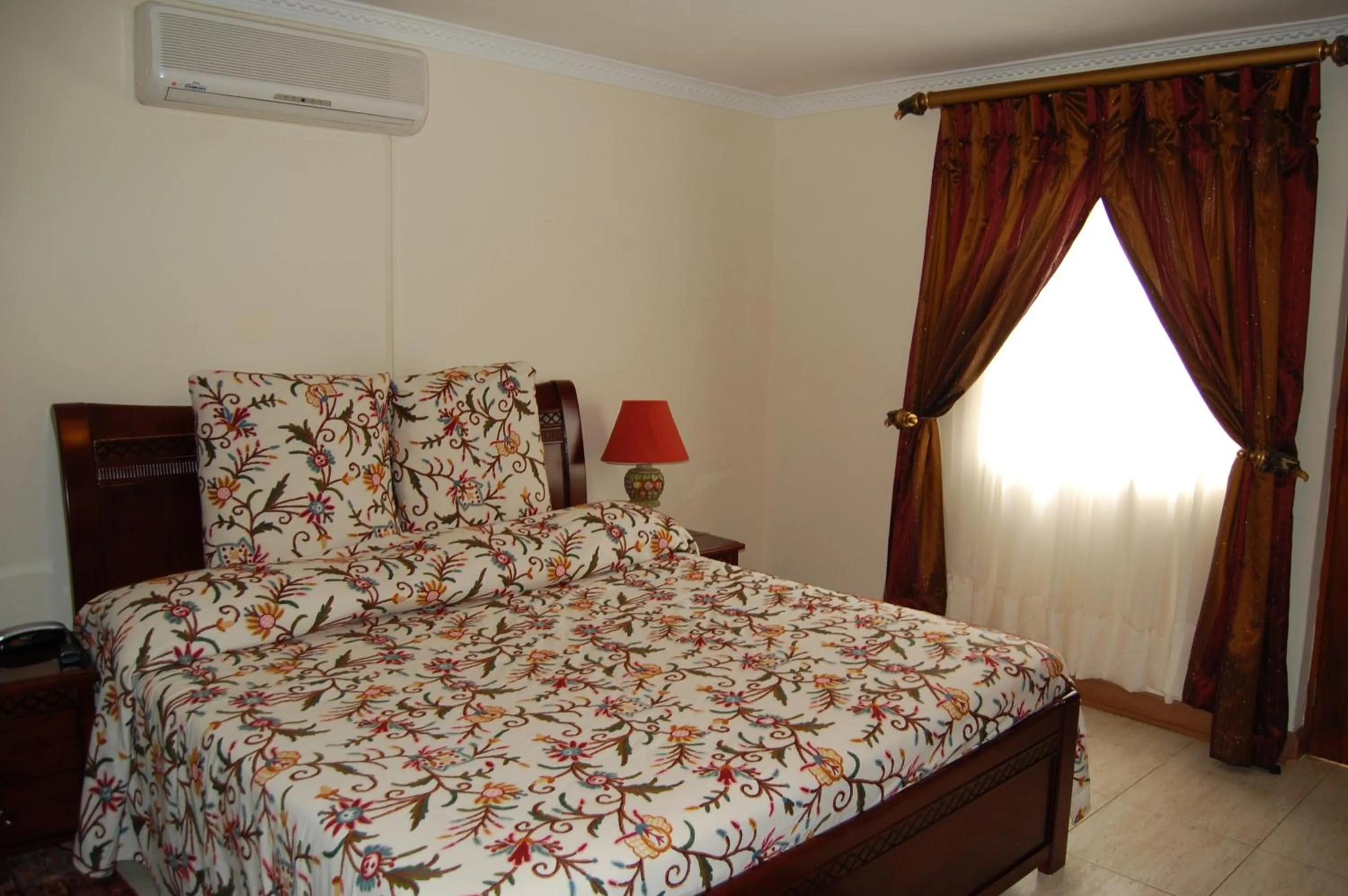 Bed in Falcon Crest Suites