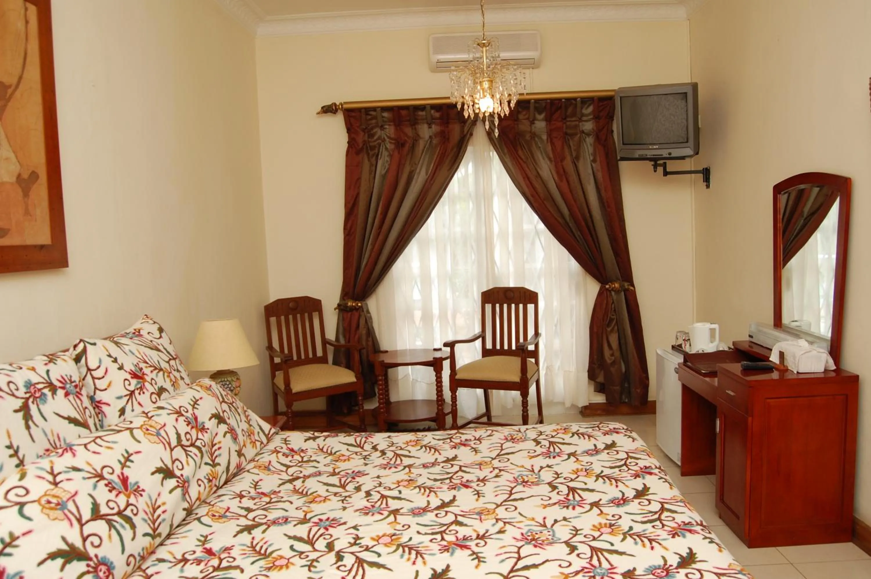 Bed in Falcon Crest Suites