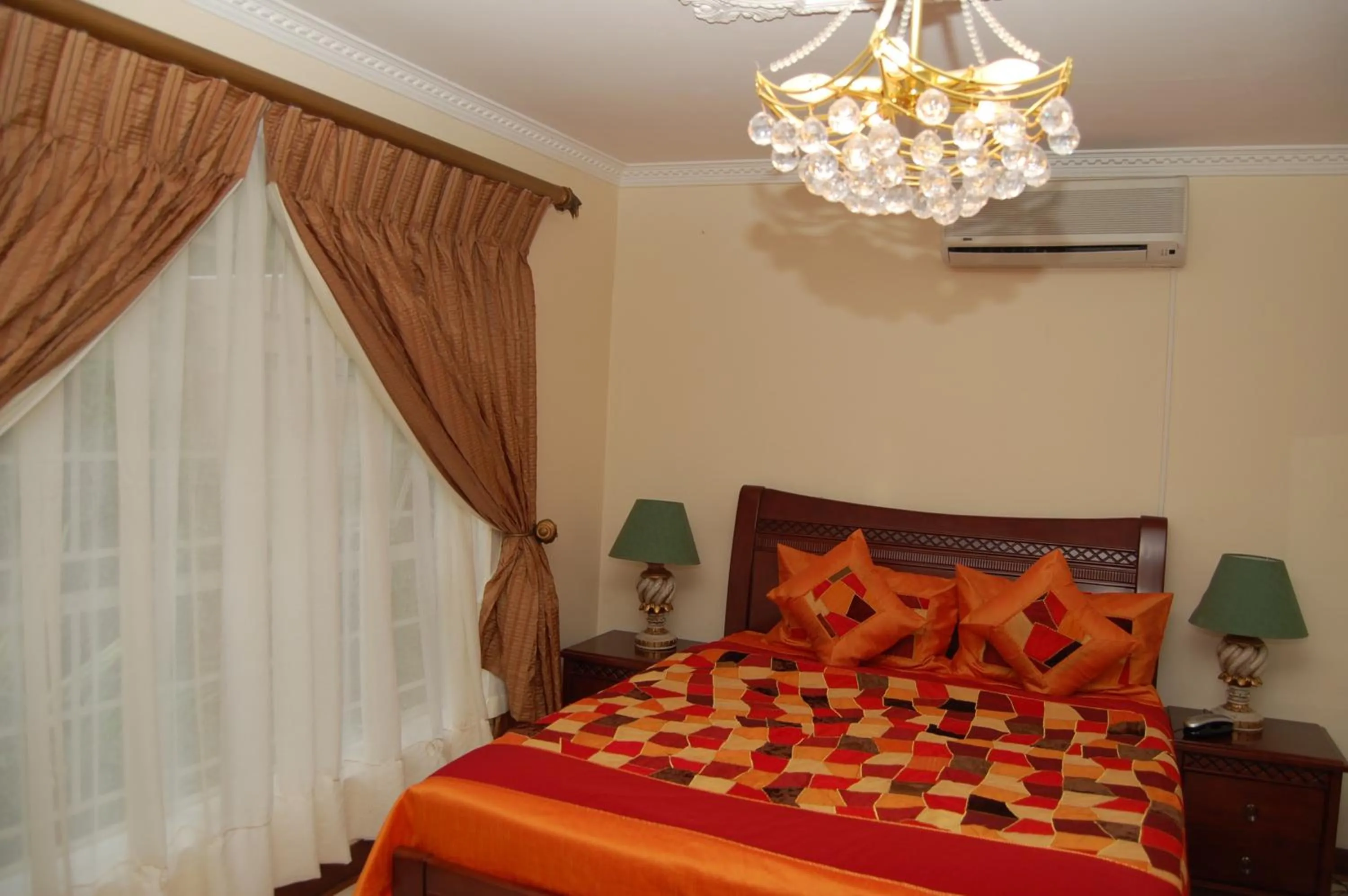 Bed in Falcon Crest Suites
