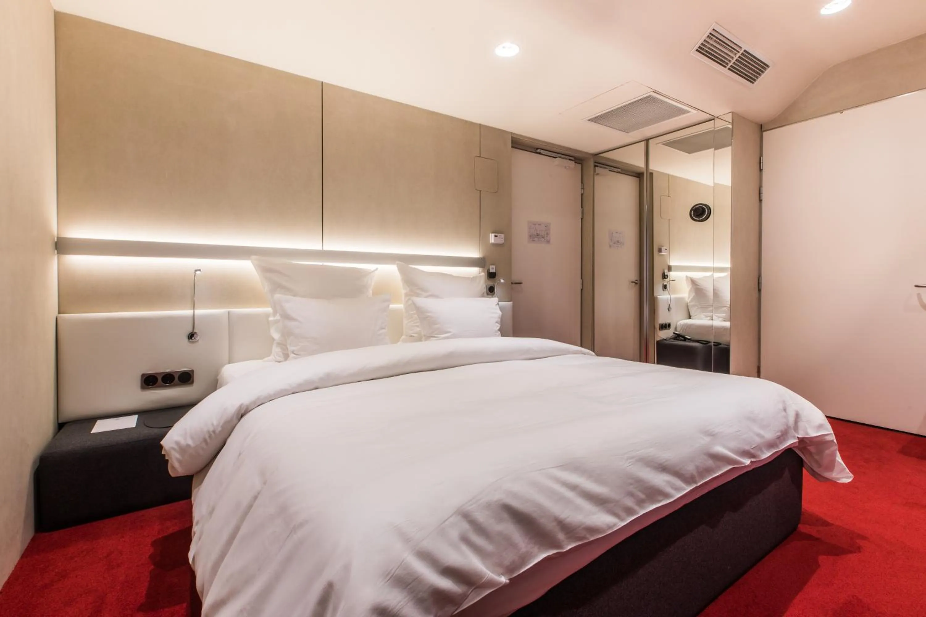 Bed in The Grove Design Hotel