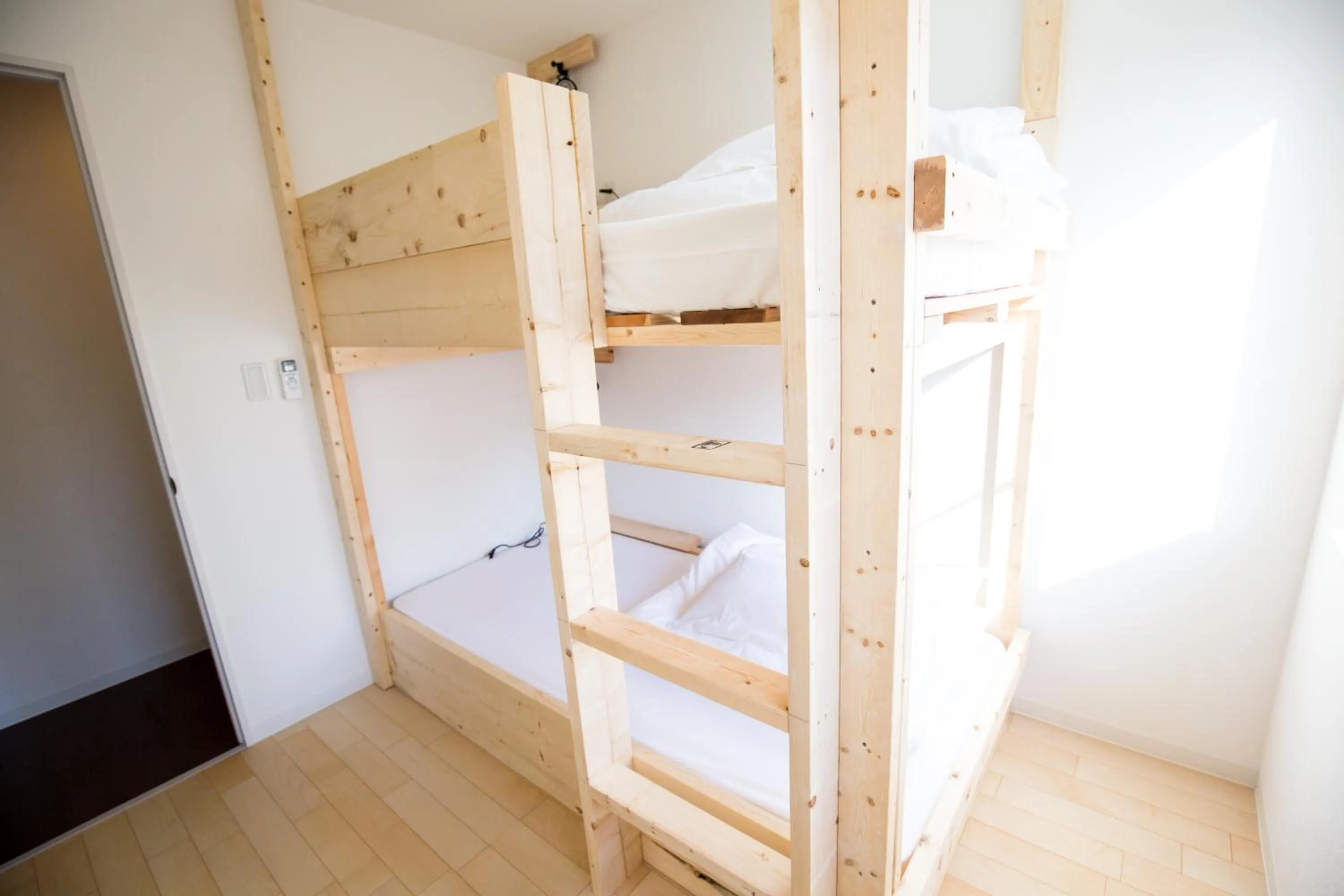 Bed in IZA Enoshima Guest House and Bar