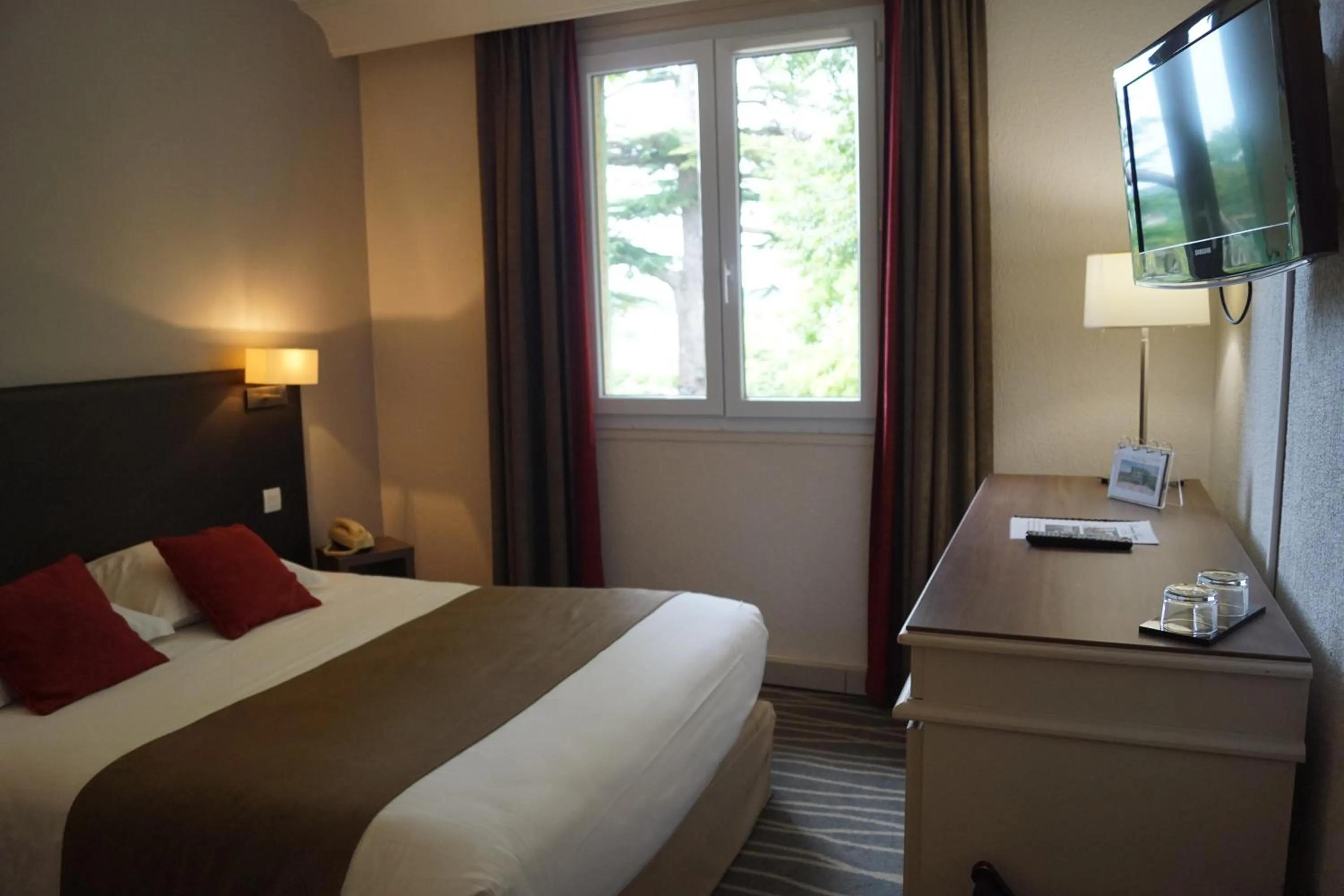 Photo of the whole room, Bed in Logis Hôtels- Hôtel et Restaurant Domaine de Fompeyre