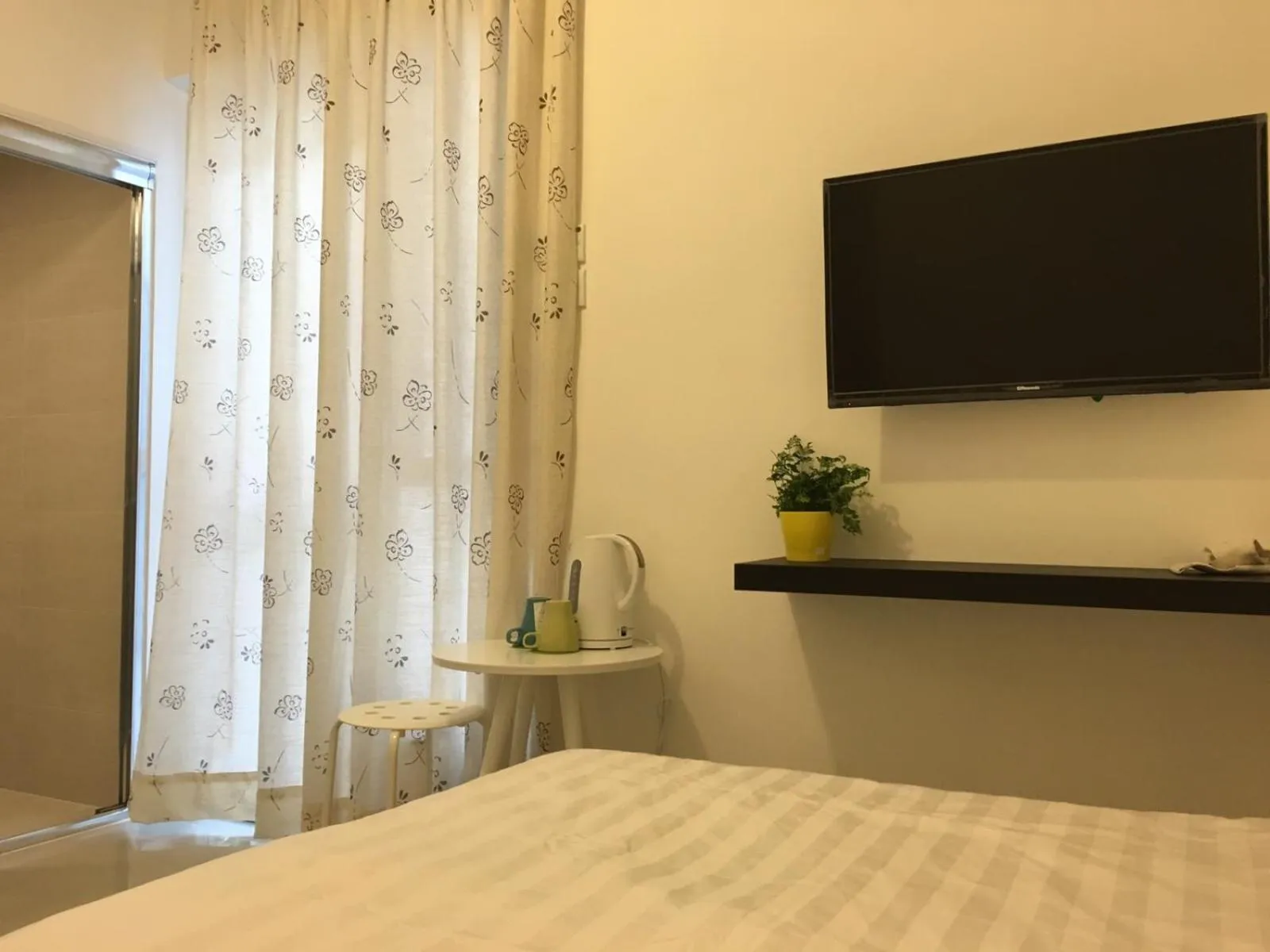 TV and multimedia, Bed in City Oasis Guesthouse