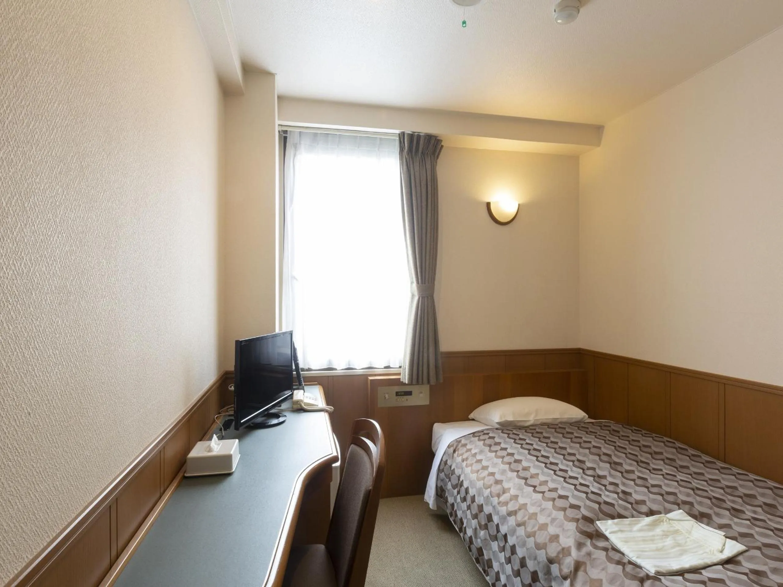 Bed in Ohta Grand Hotel