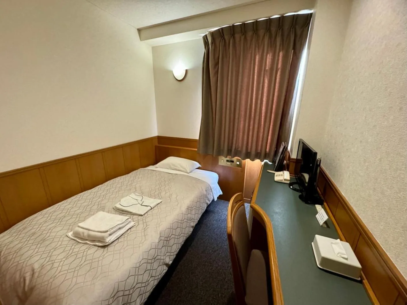 Bed in Ohta Grand Hotel