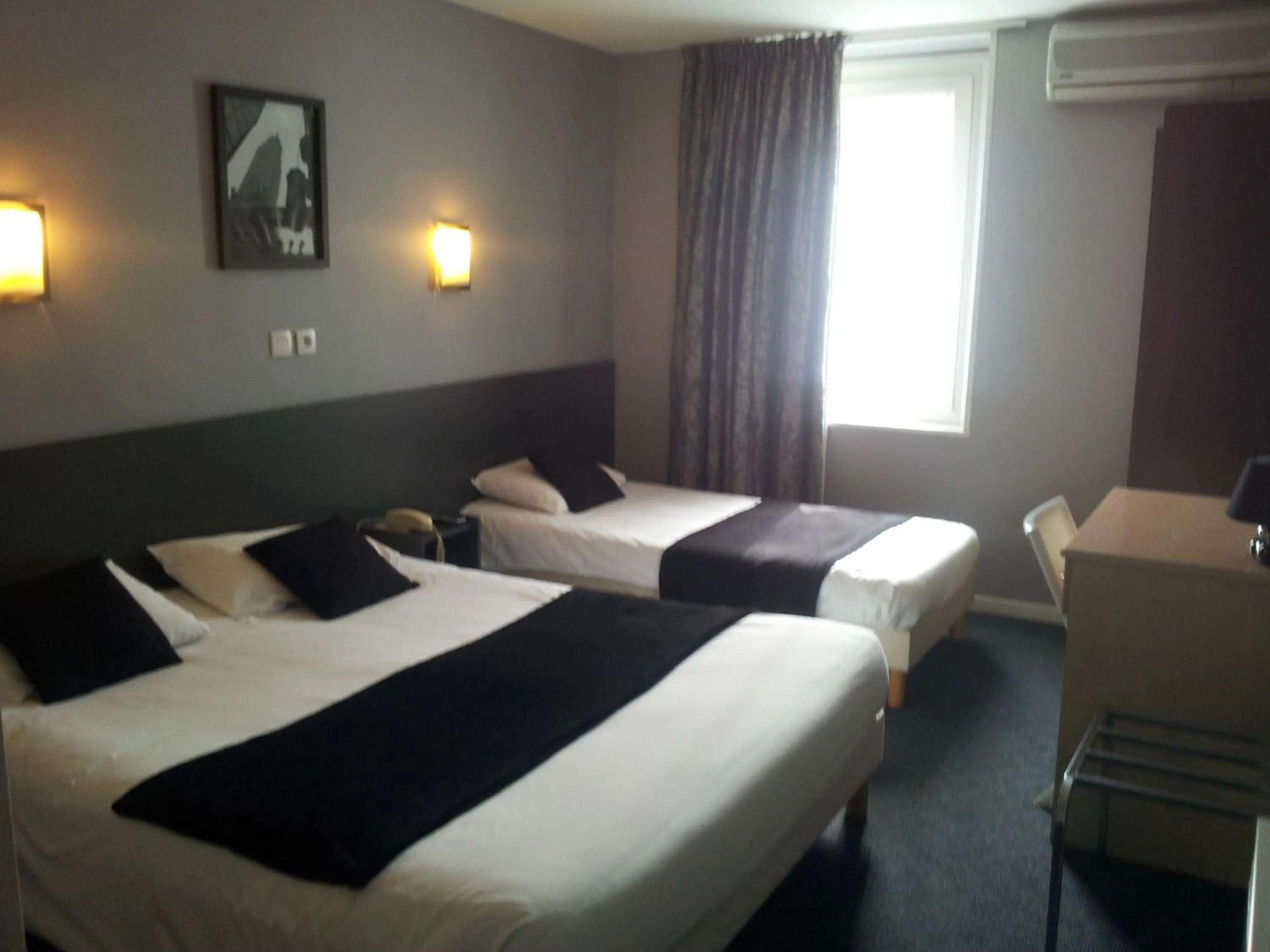 Photo of the whole room, Bed in Hôtel Du Midi