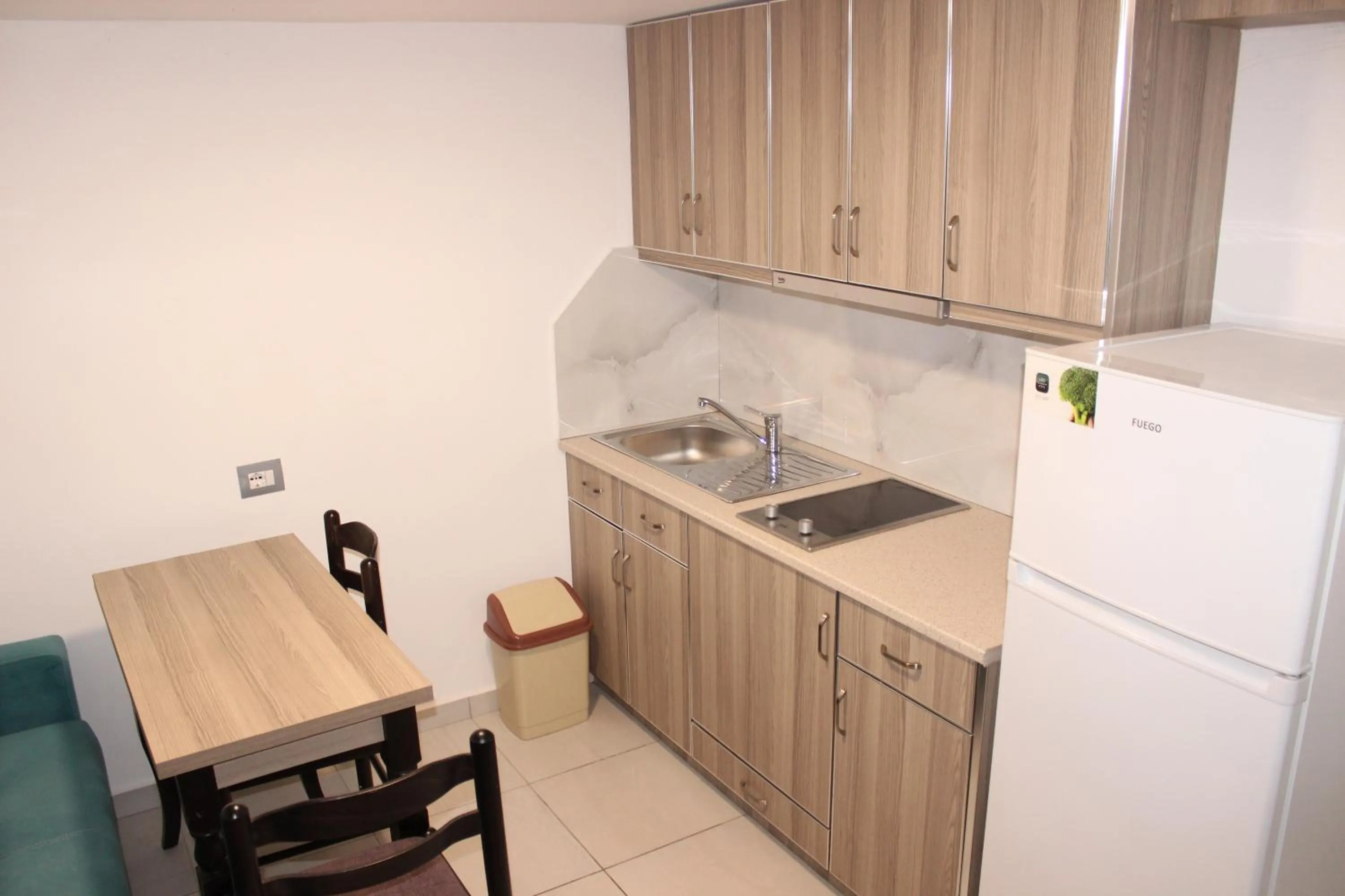 Kitchen or kitchenette in Bebi Hotel And Apartments