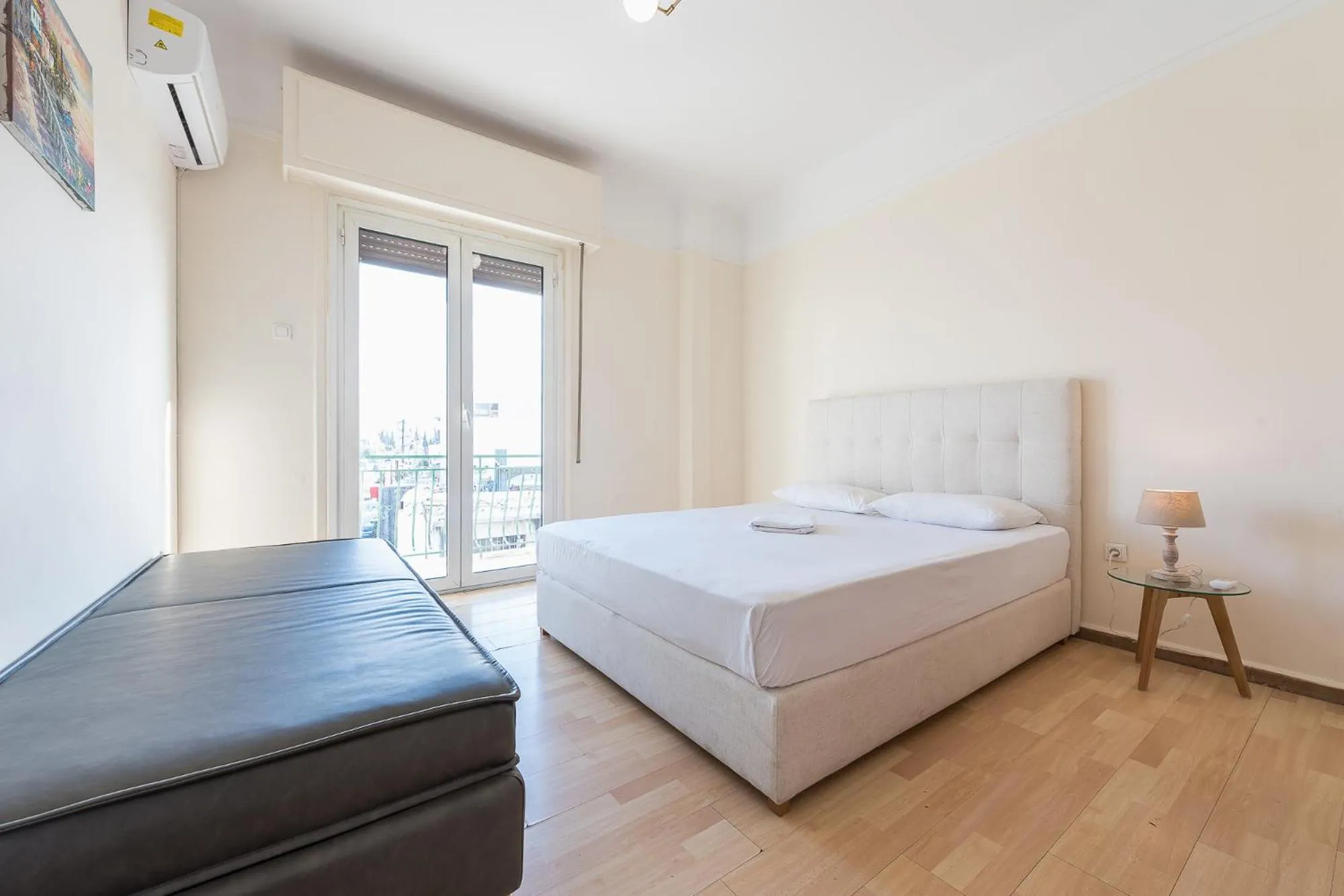 Bed in Super Paradise Apartments