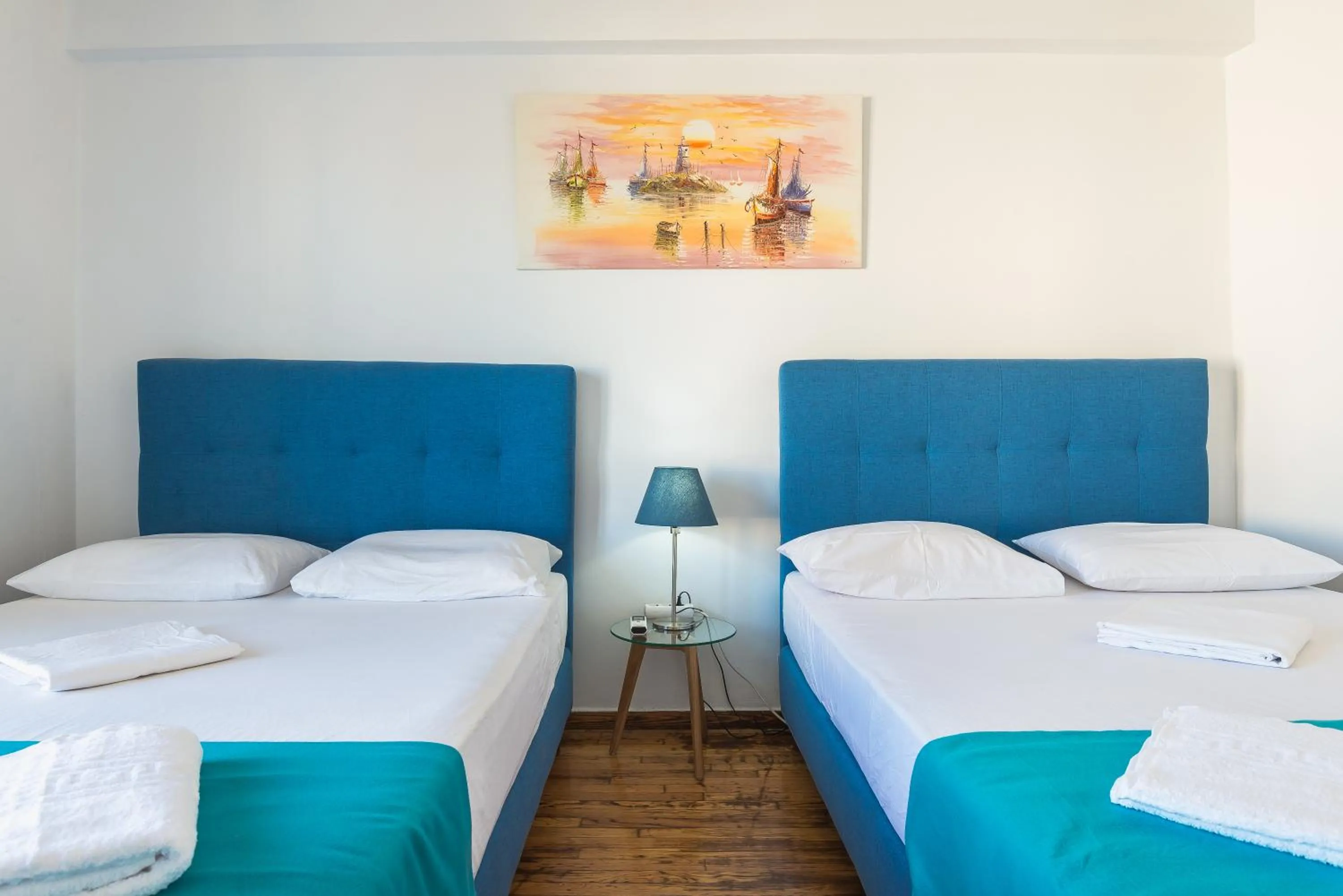 Bed in Super Paradise Apartments