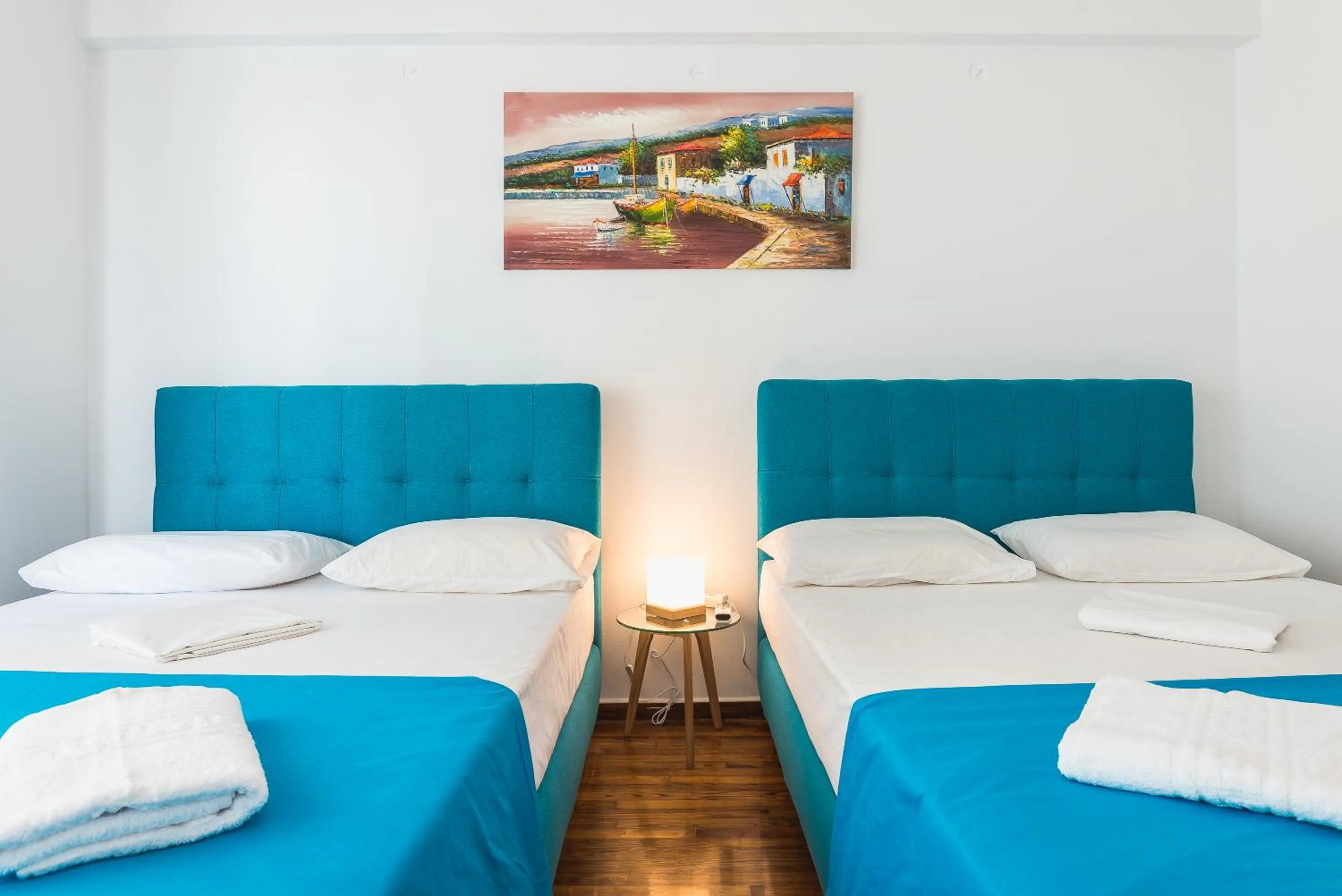 Bed in Super Paradise Apartments