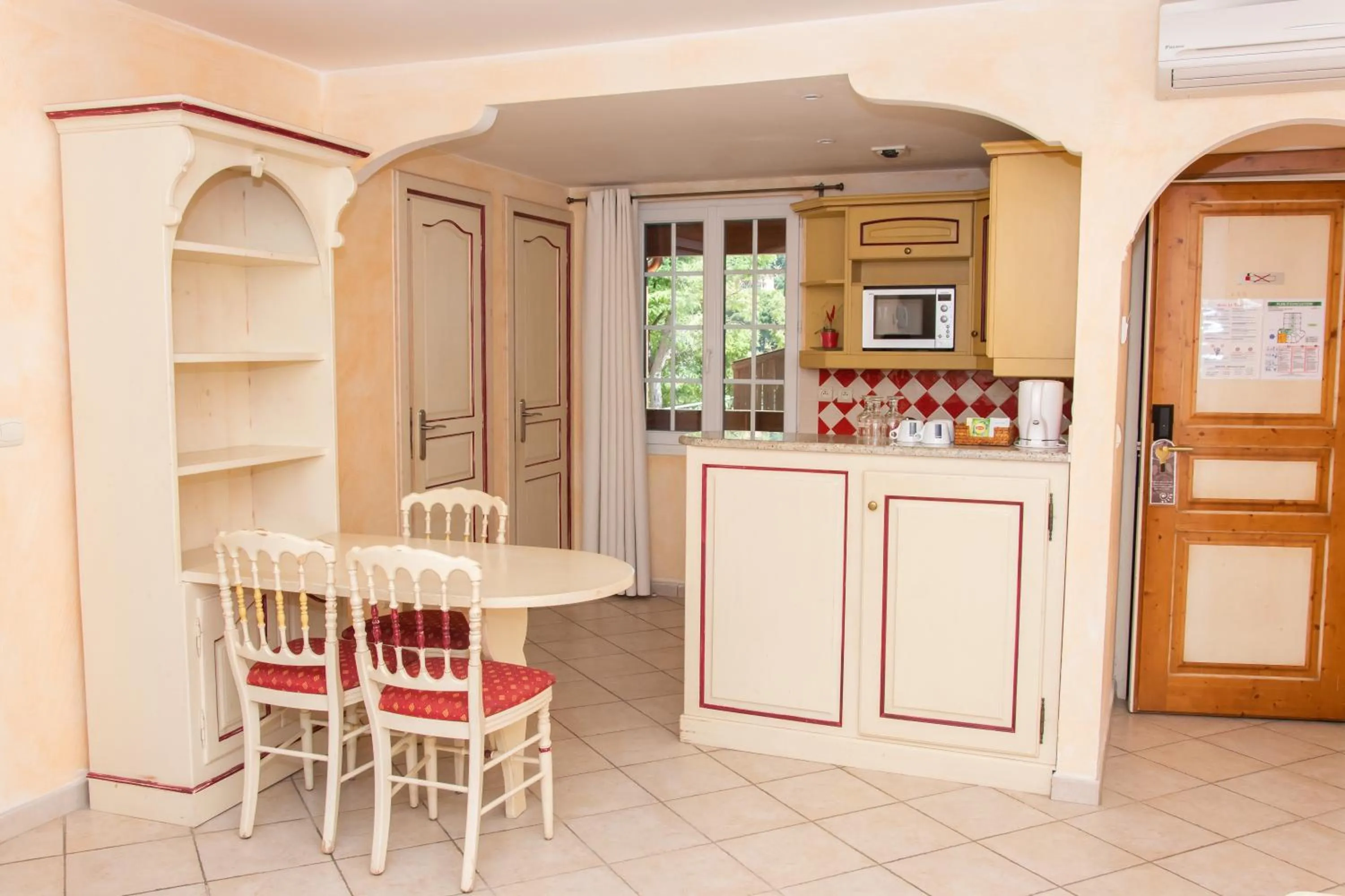 Kitchen or kitchenette in Hôtel & Spa La Villa