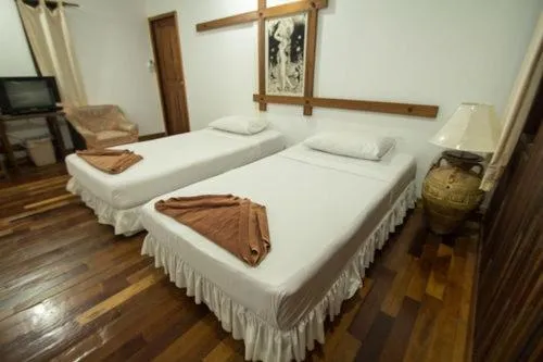 Bed in Tropical Garden Bungalow