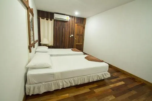 Bed in Tropical Garden Bungalow
