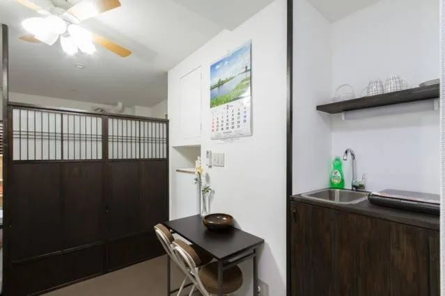 Kitchen or kitchenette in Osaka Nakayama Guesthouse