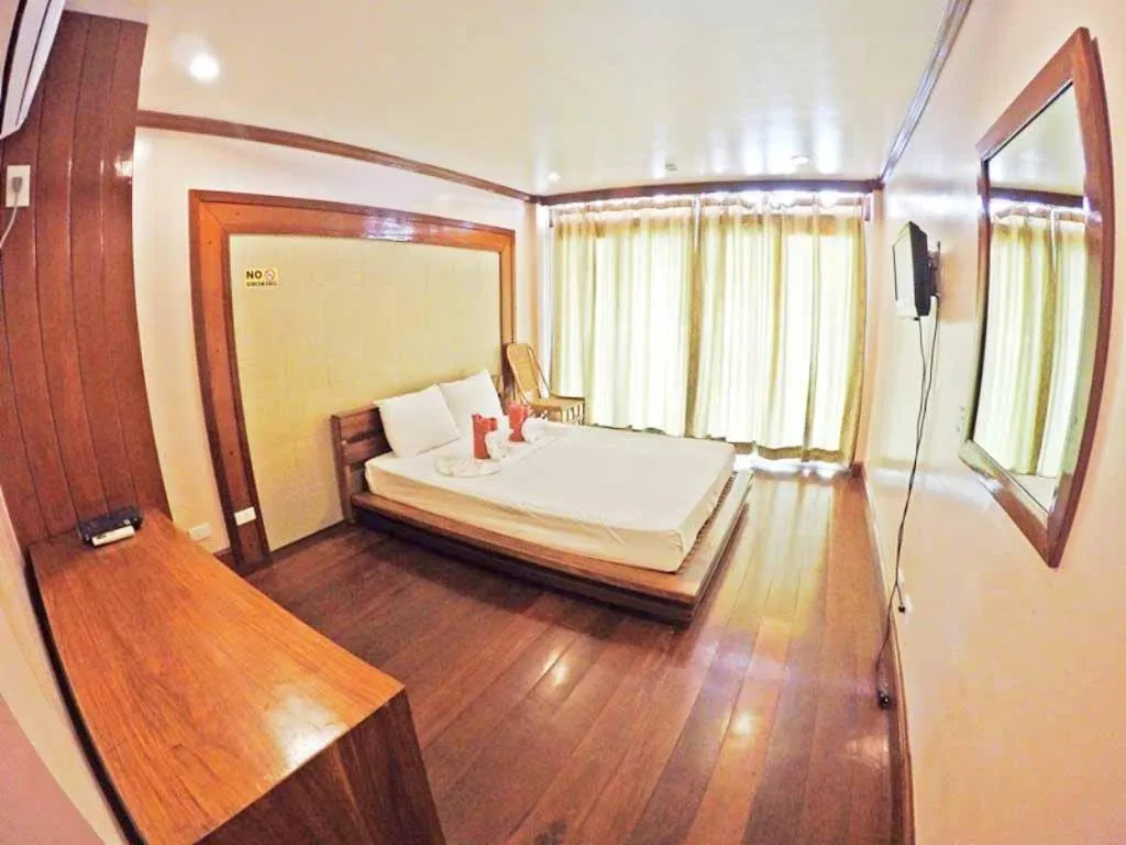 Balcony/Terrace, Bed in El Nido Beach Hotel