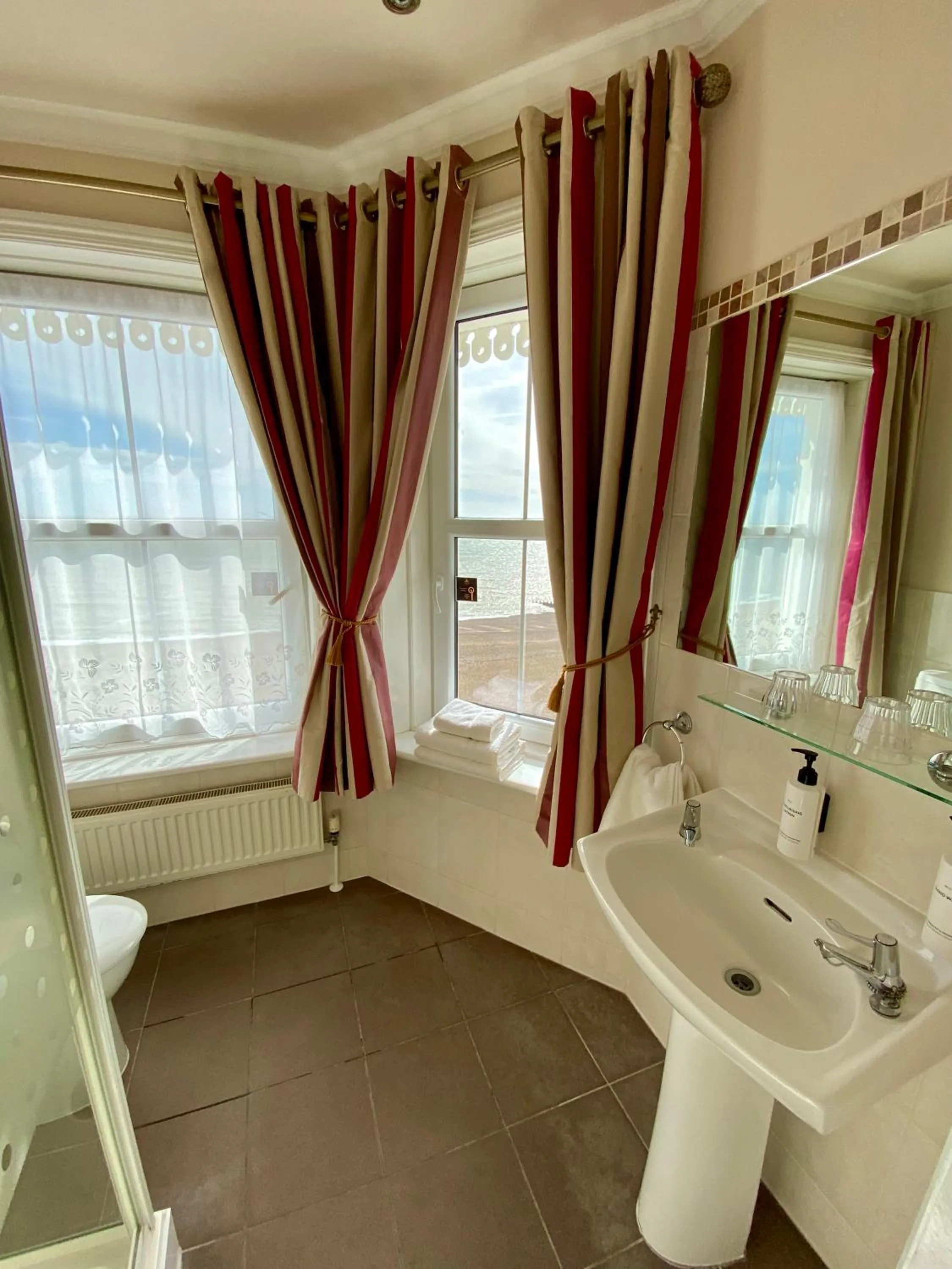 Toilet in East Beach Hotel