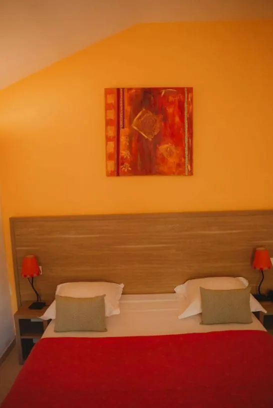 Bed in Hôtel Le Mas des Ecureuils