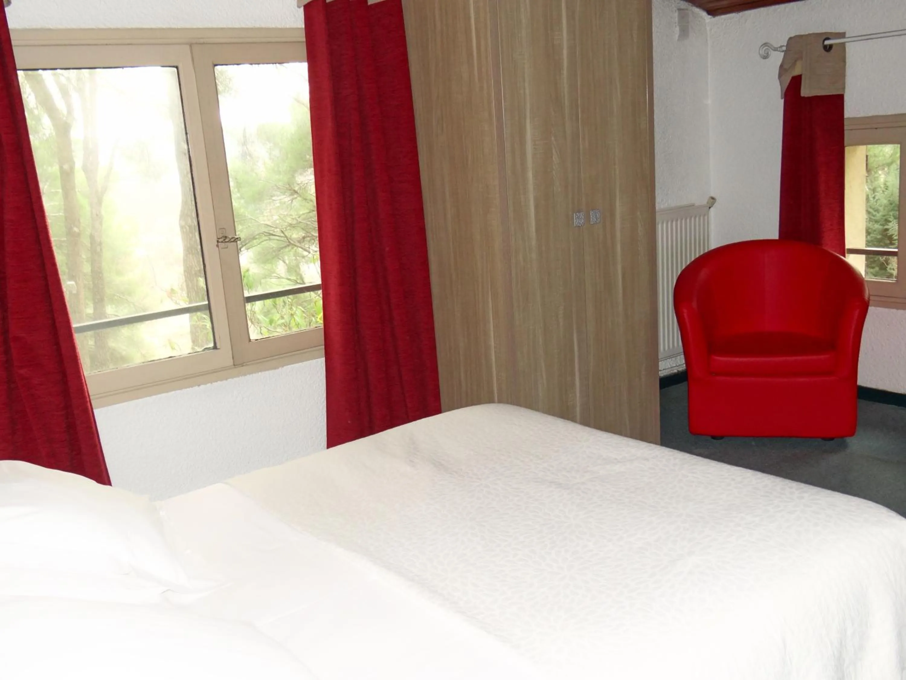 View (from property/room), Bed in Hôtel Le Mas des Ecureuils