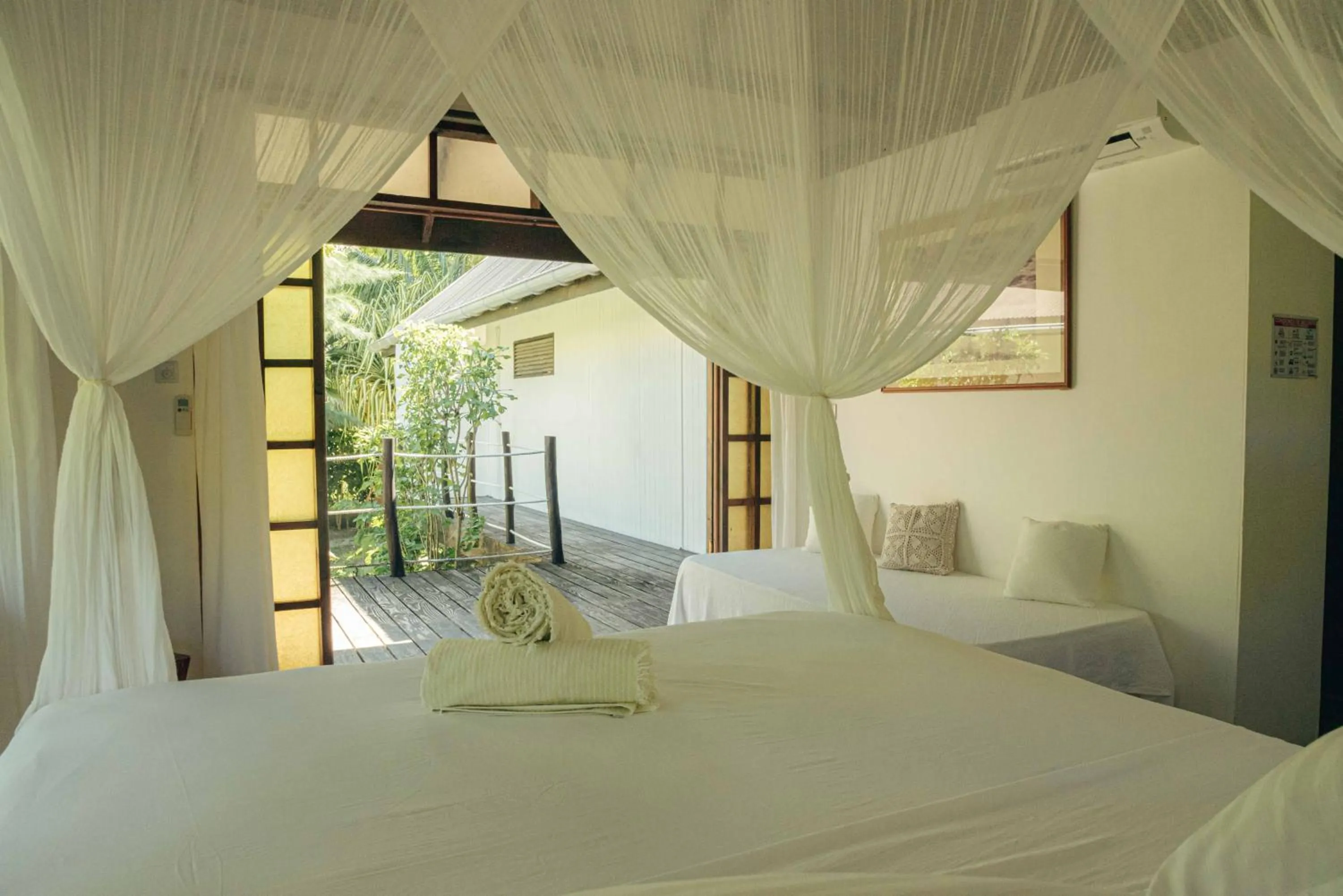 Bed in Le Coconut Lodge