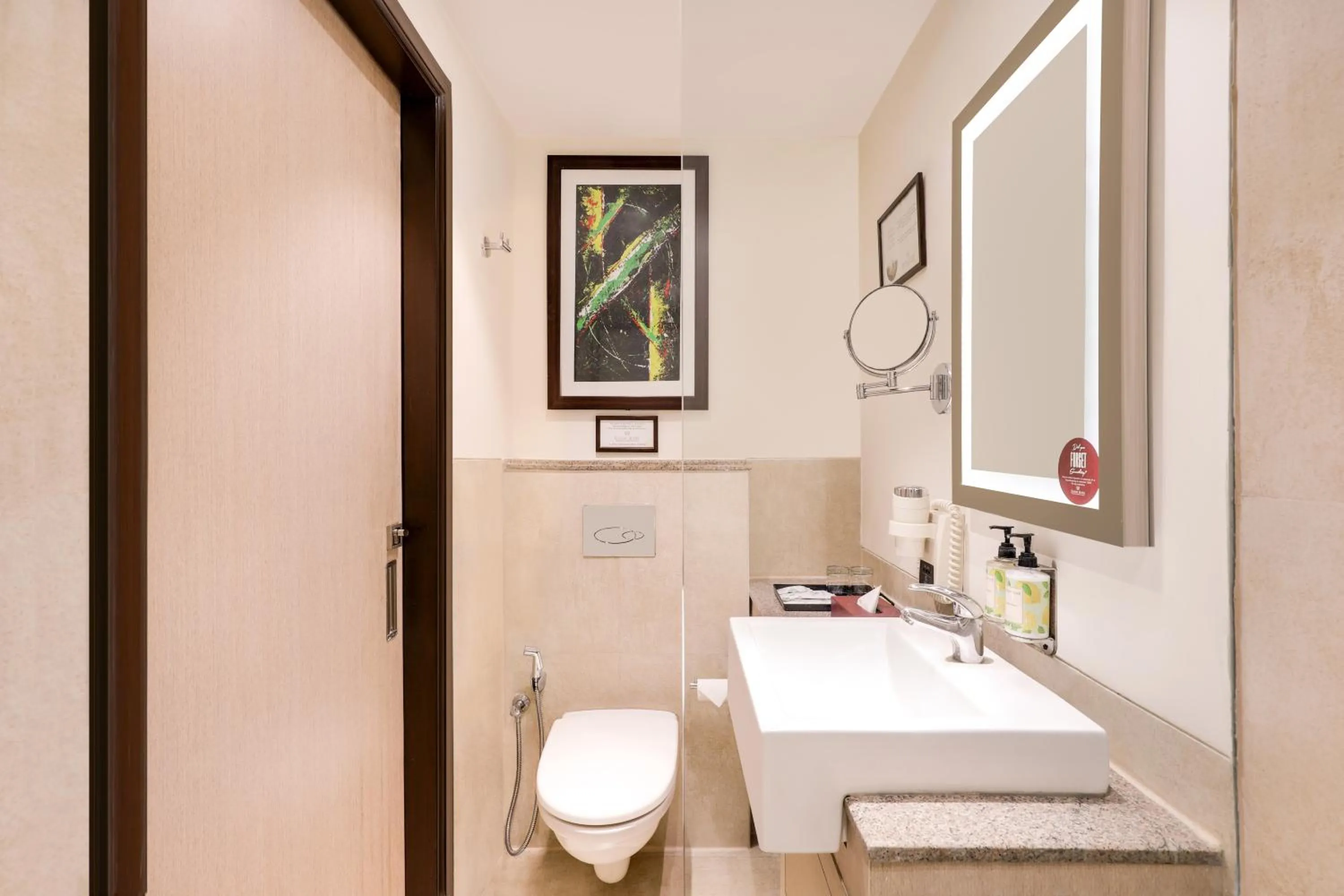 Bathroom in Sandal Suites by Lemon Tree Hotels