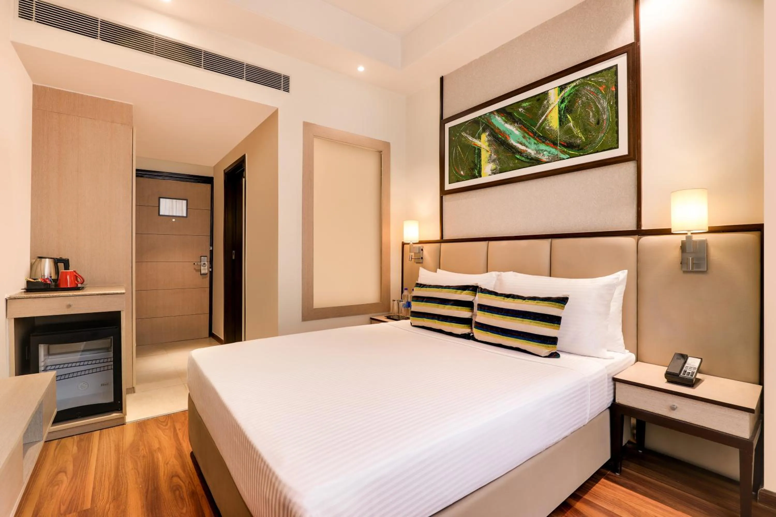 Bedroom, Bed in Sandal Suites by Lemon Tree Hotels