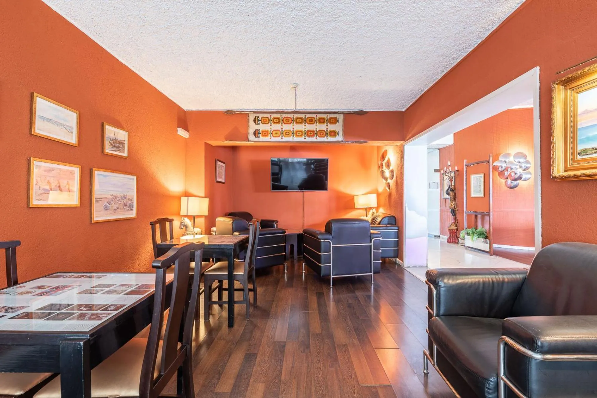 Communal lounge/ TV room in Carvoeiro Garden Hotel