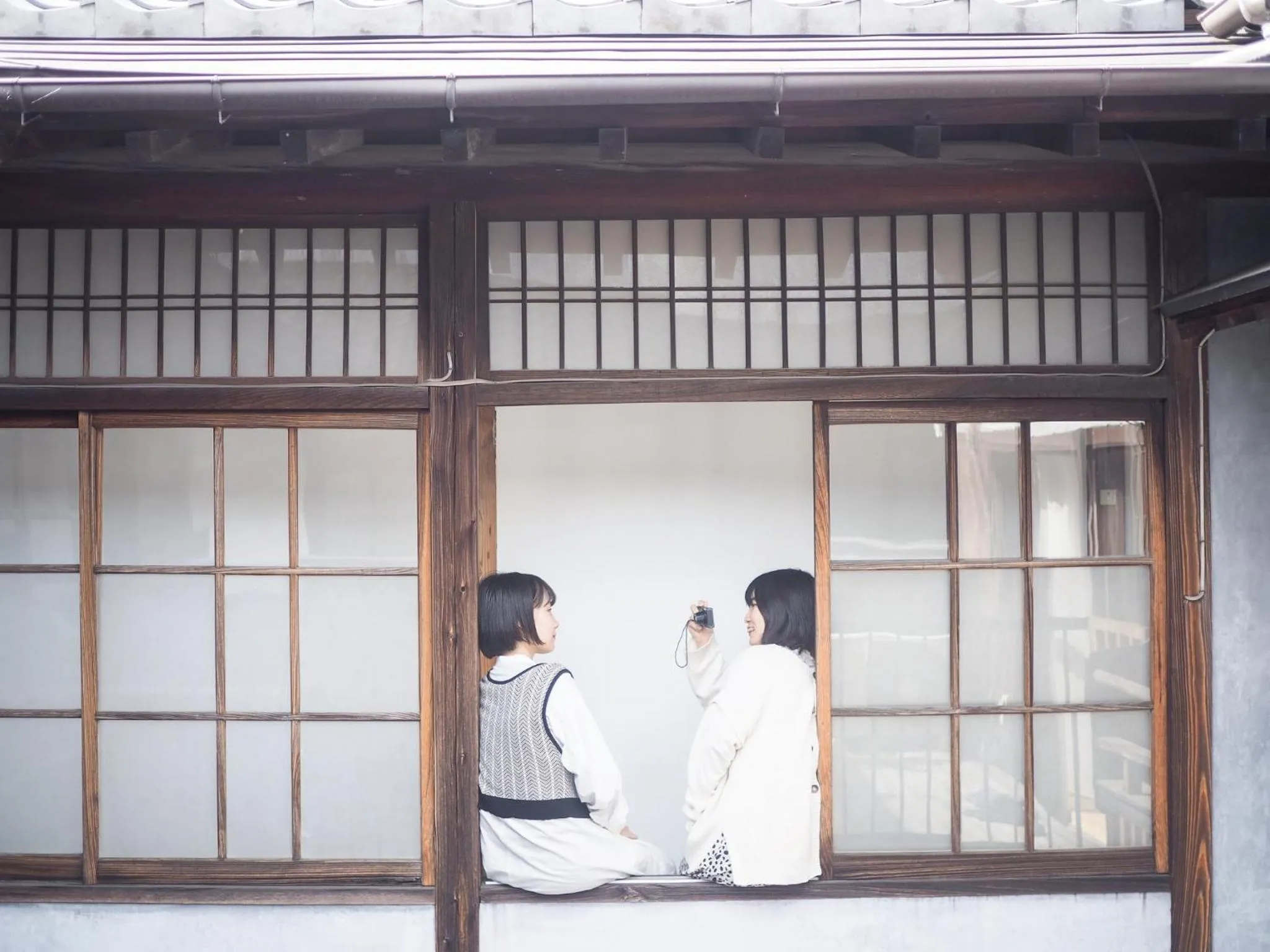 People in Taketa Ekimae Hostel cue