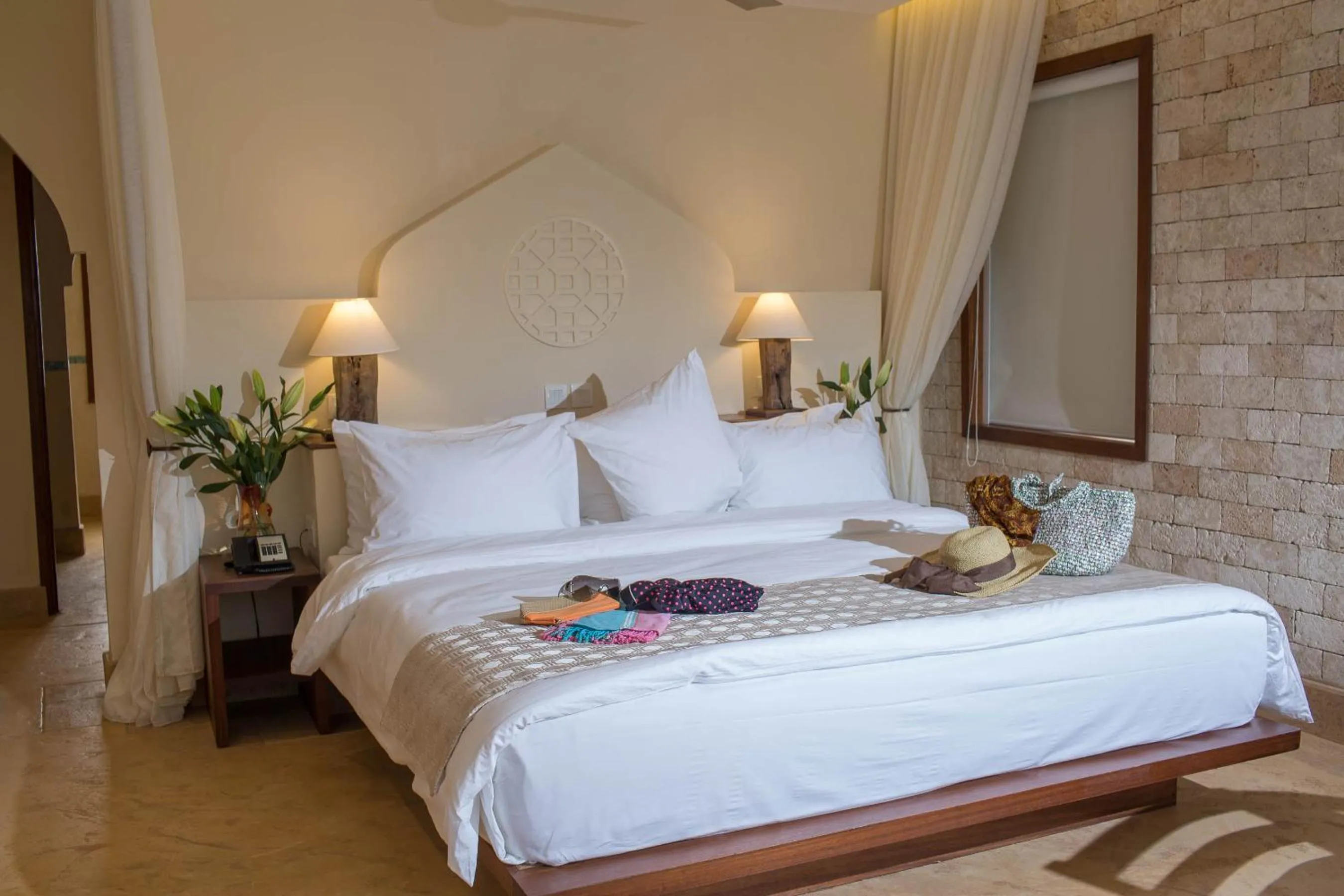 Bed in Silver Palm Spa & Resort