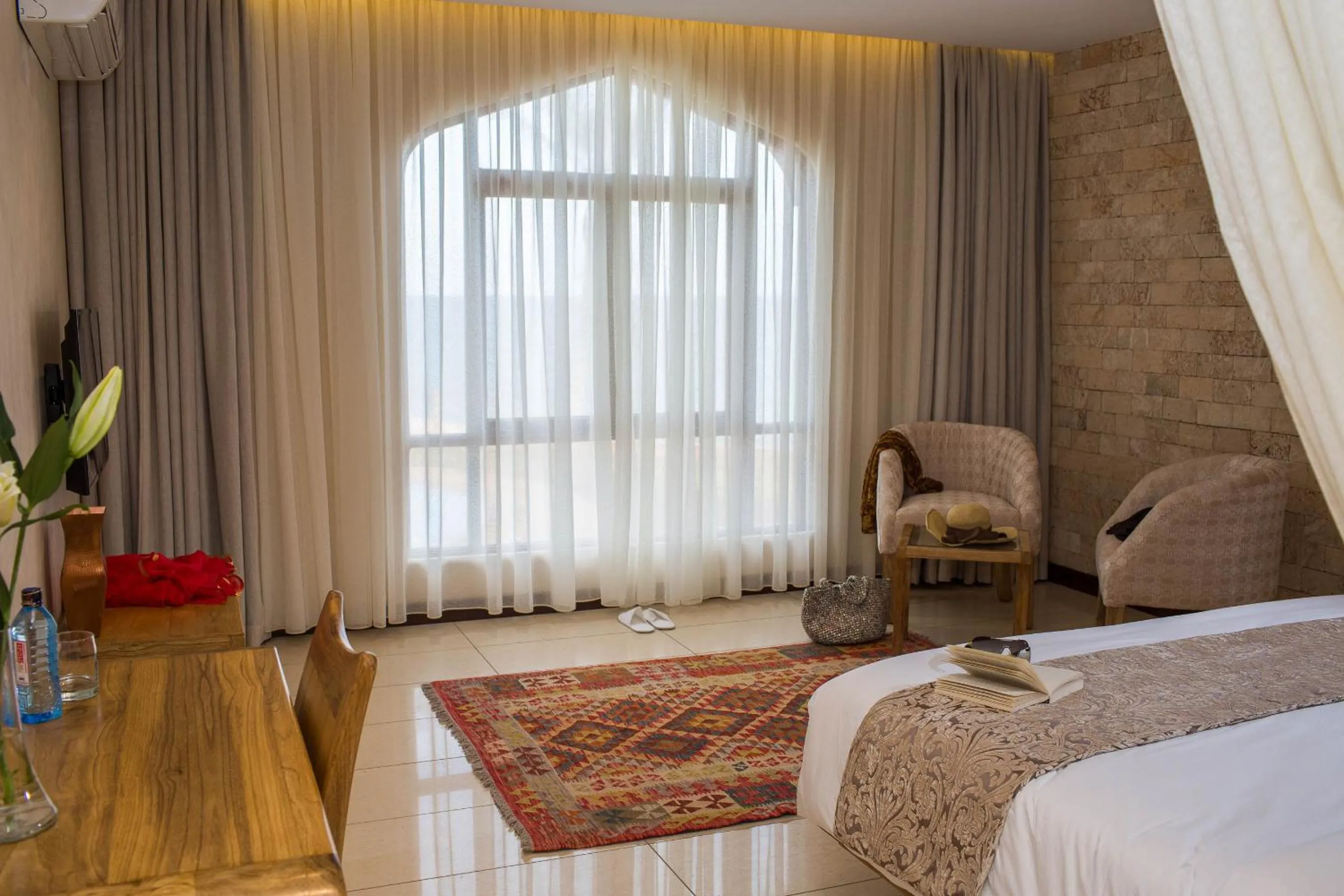 Bed in Silver Palm Spa & Resort