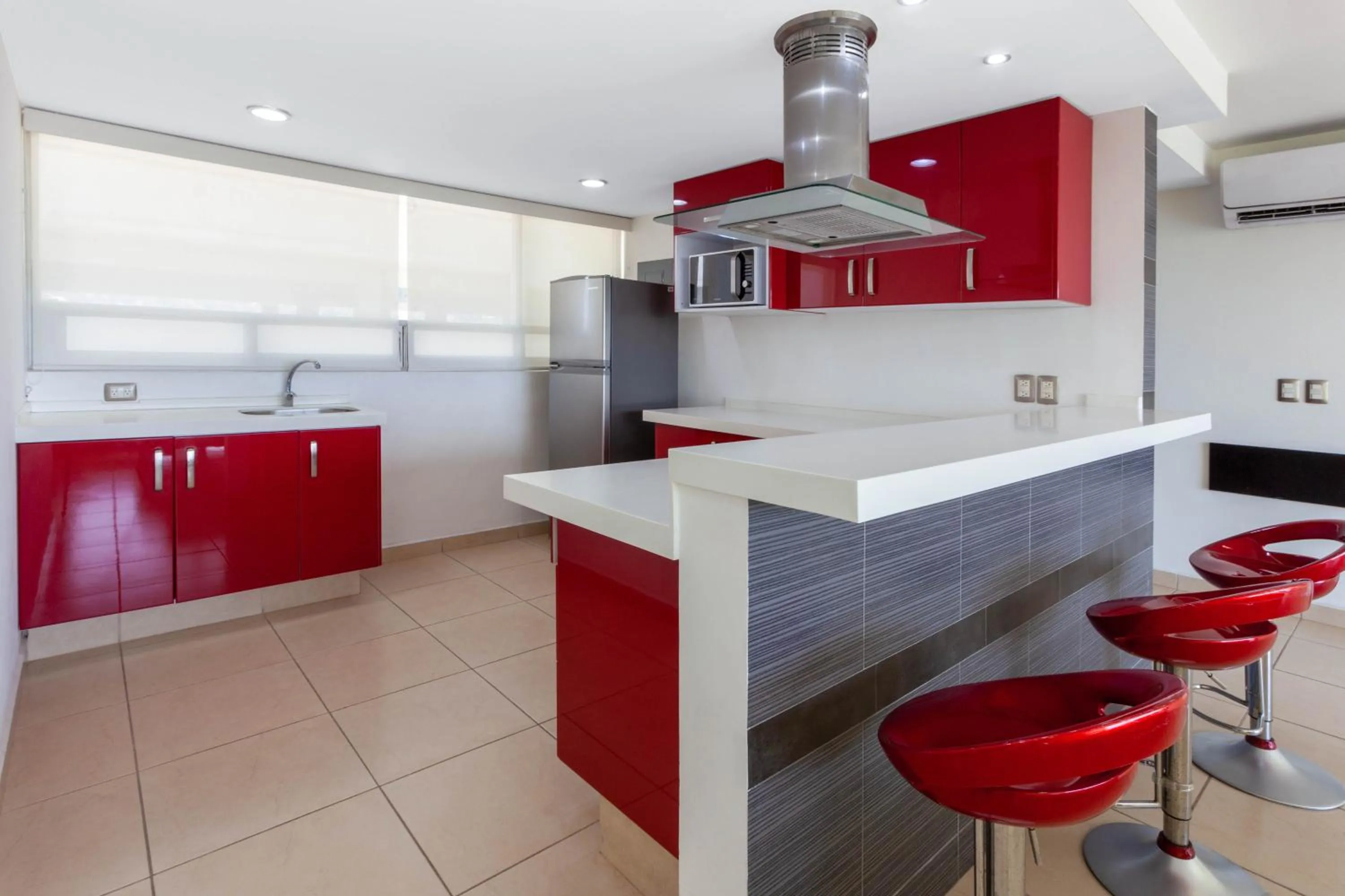 Kitchen or kitchenette in Ramada by Wyndham Acapulco Hotel & Suites