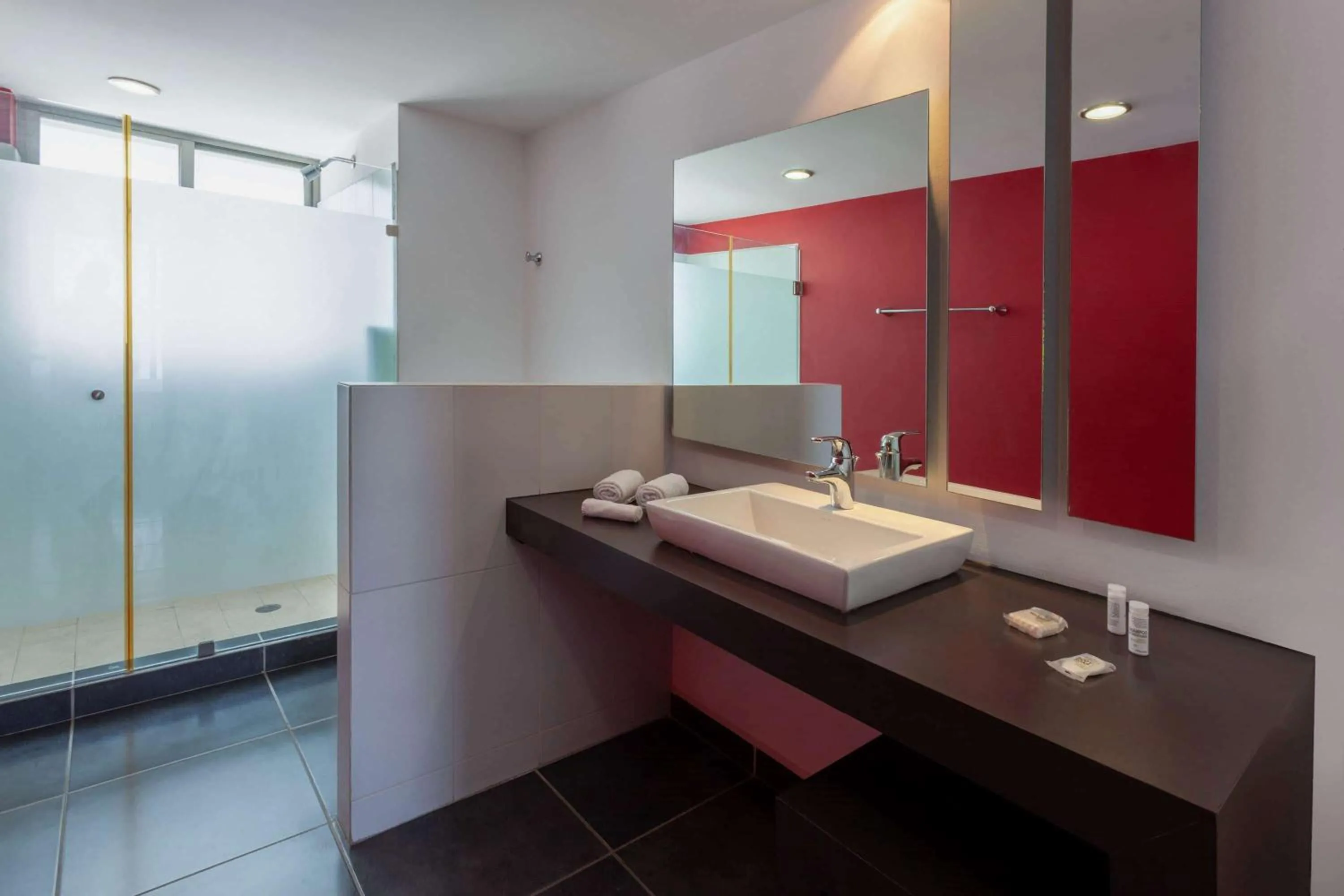 Bathroom in Ramada by Wyndham Acapulco Hotel & Suites