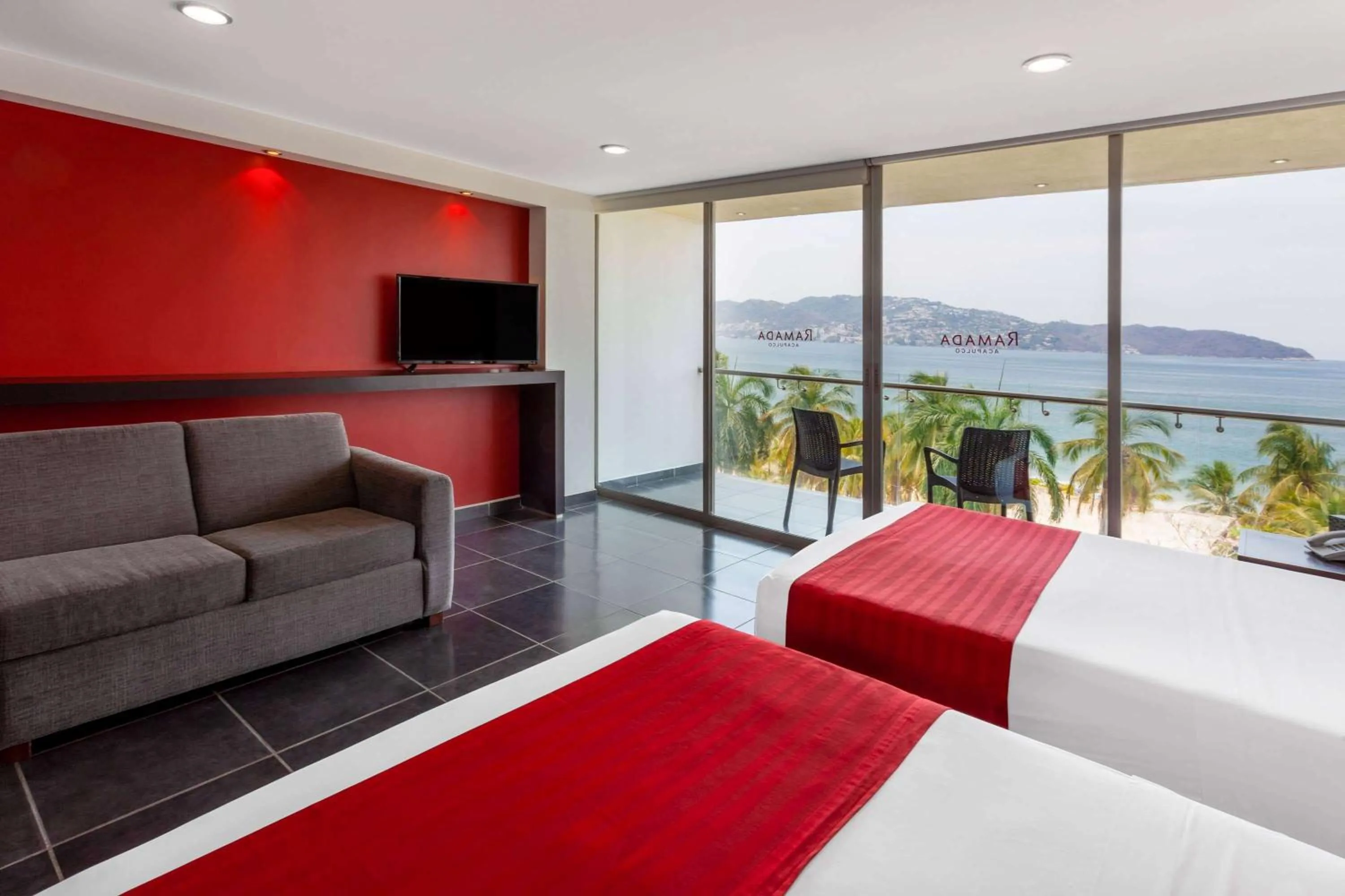 Photo of the whole room, Bed in Ramada by Wyndham Acapulco Hotel & Suites