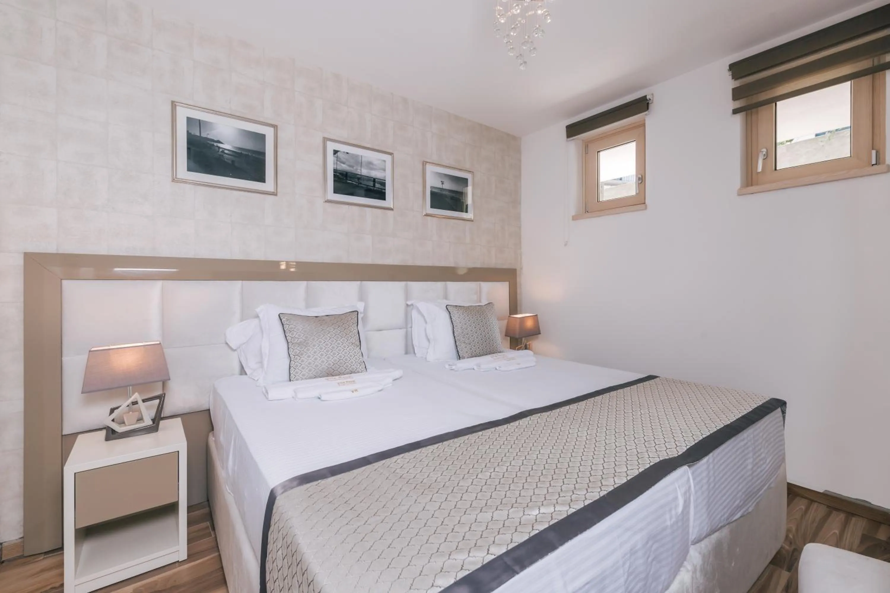 Bed in Villa Royal Apartments