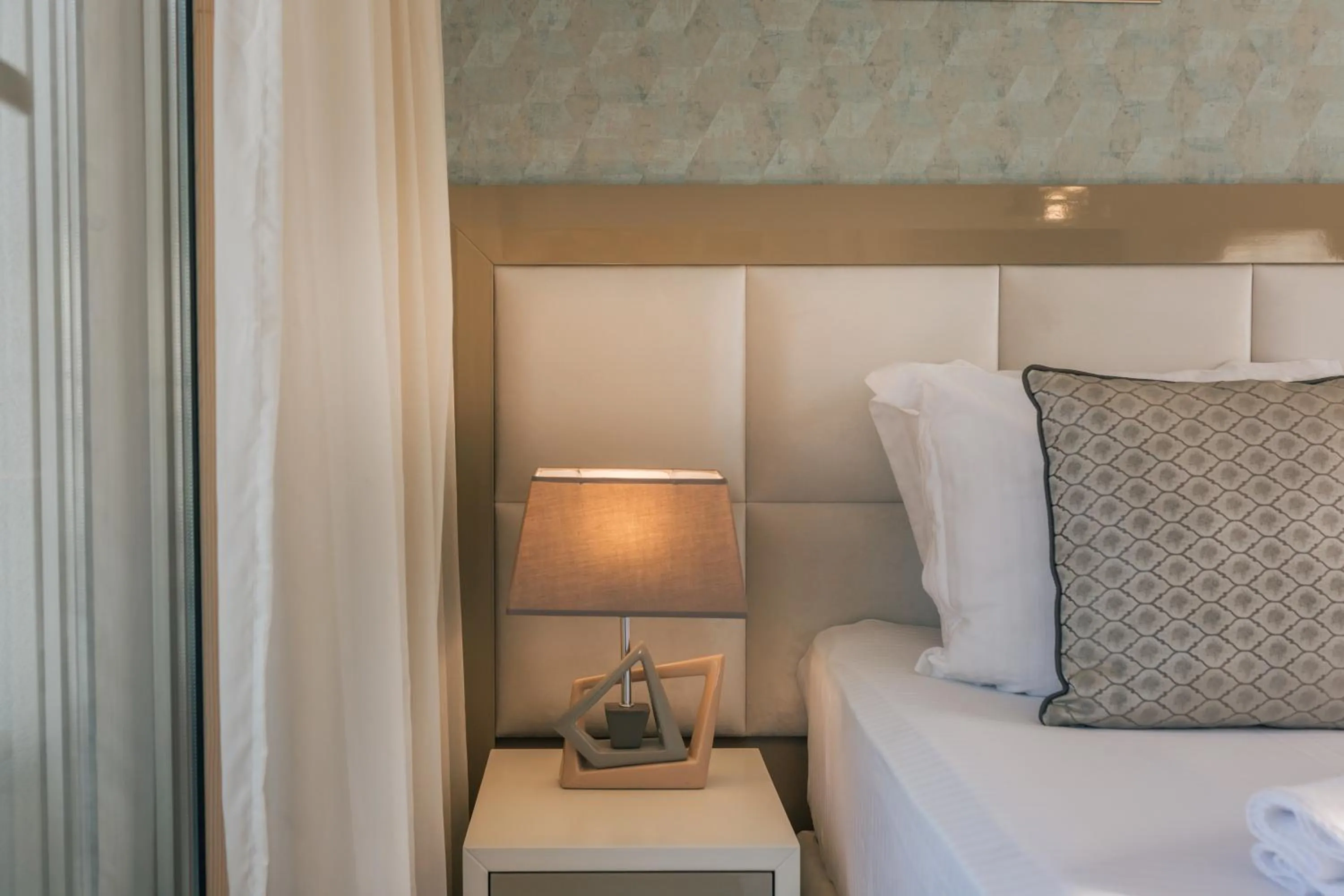 Bed in Villa Royal Apartments