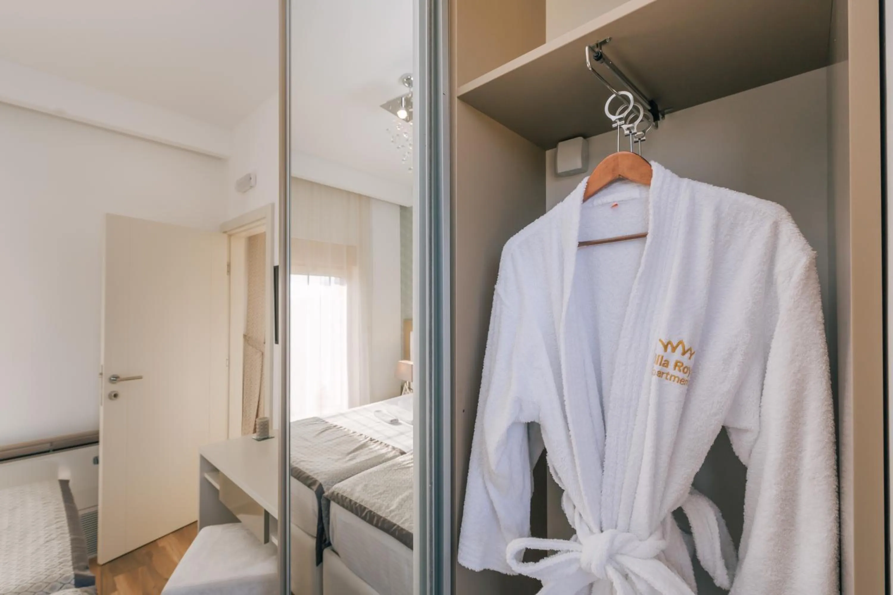 Property logo or sign, Bed in Villa Royal Apartments