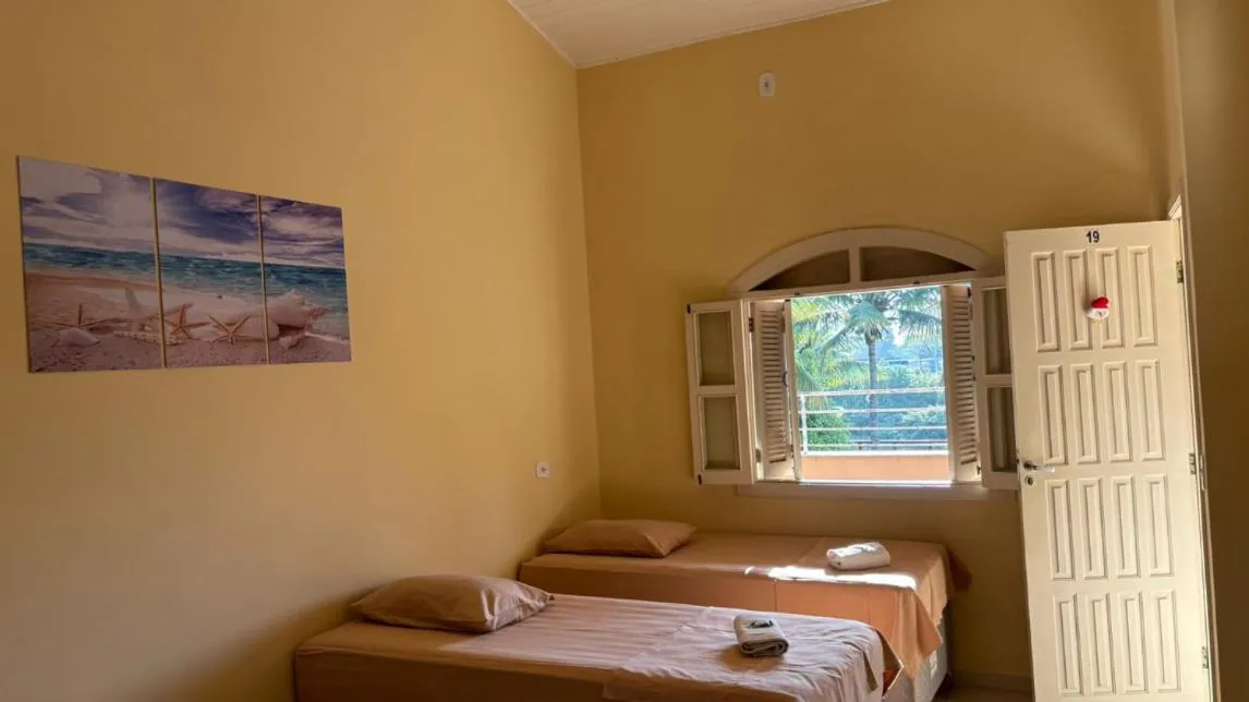 Bed in Pousada Porto do Rio