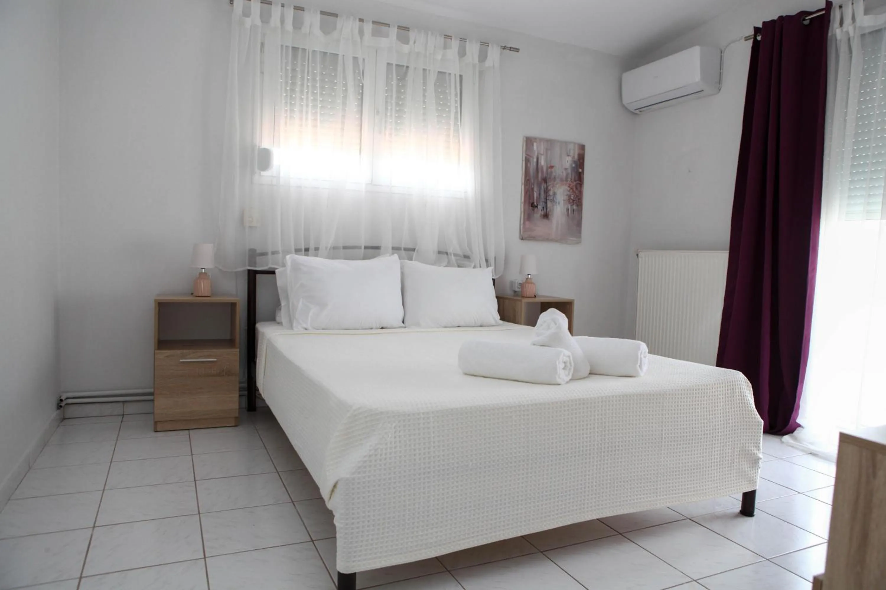 Bed in Nicole Fresh Apartments