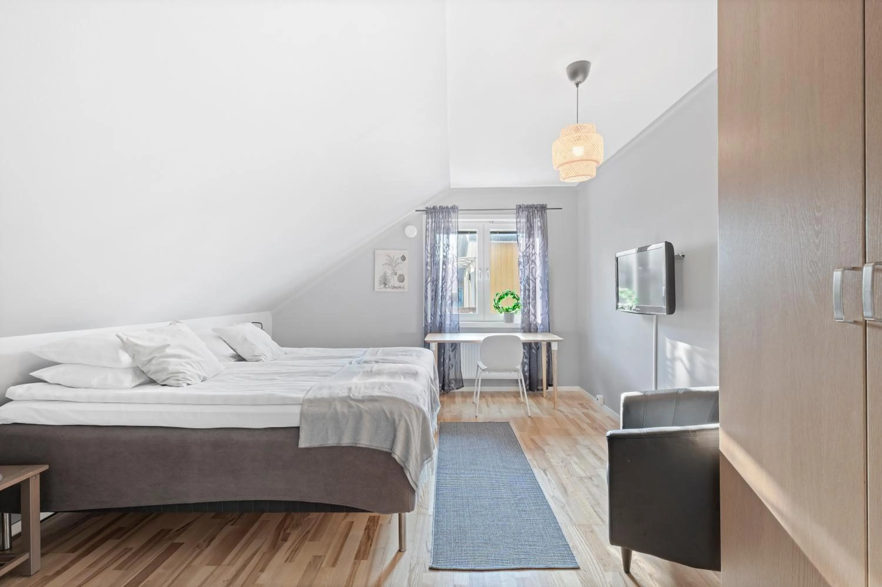 Bed in Uppsala Lägenhetshotell