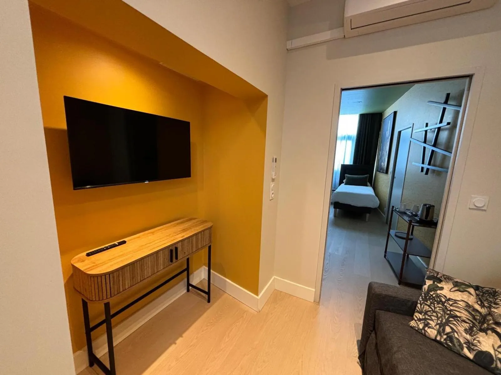 Communal lounge/ TV room, Bed in Hôtel Le Blason