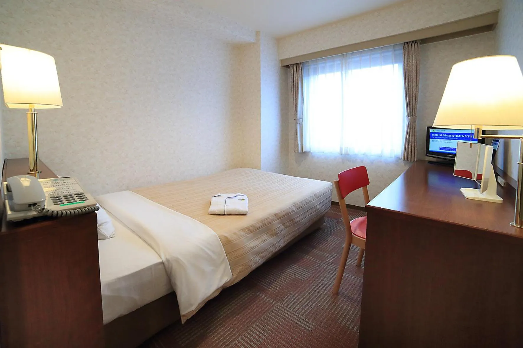 Bed in Kumegawa Wing Hotel