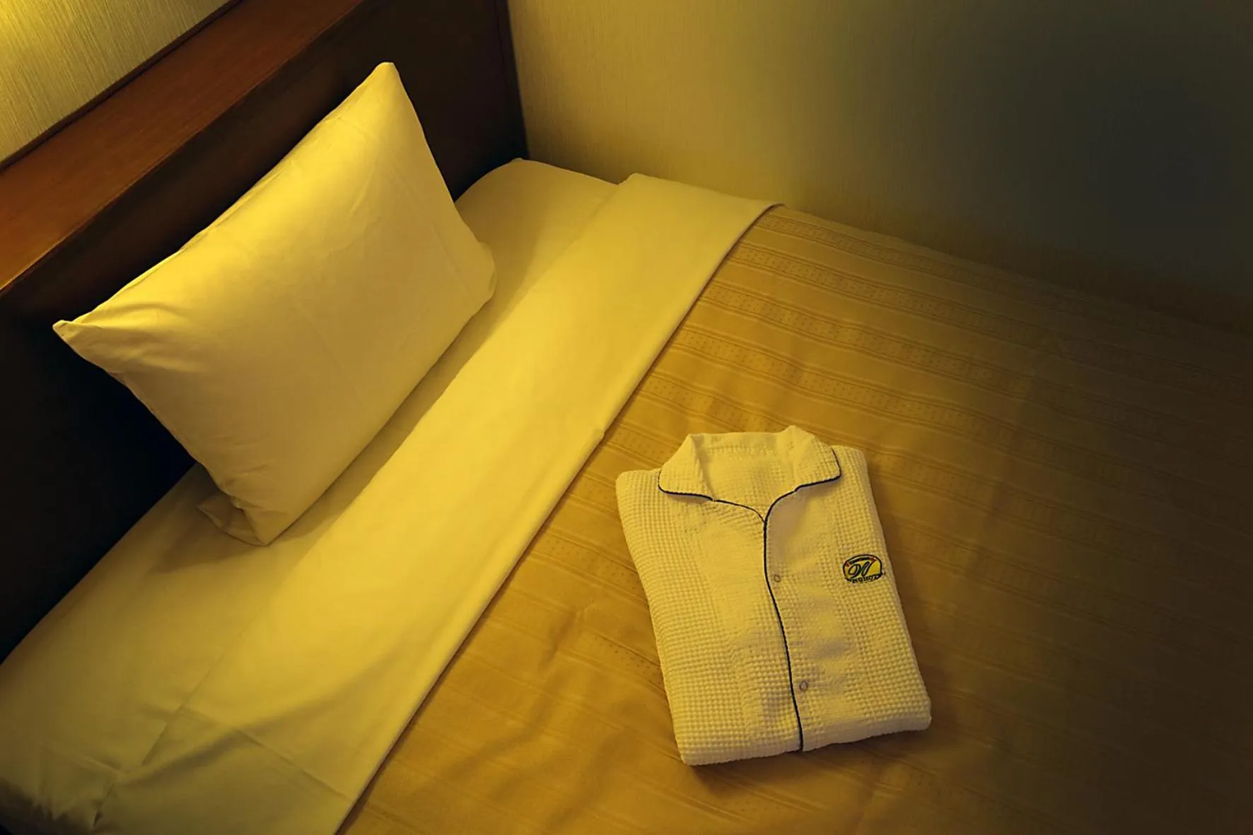 Bed in Kumegawa Wing Hotel