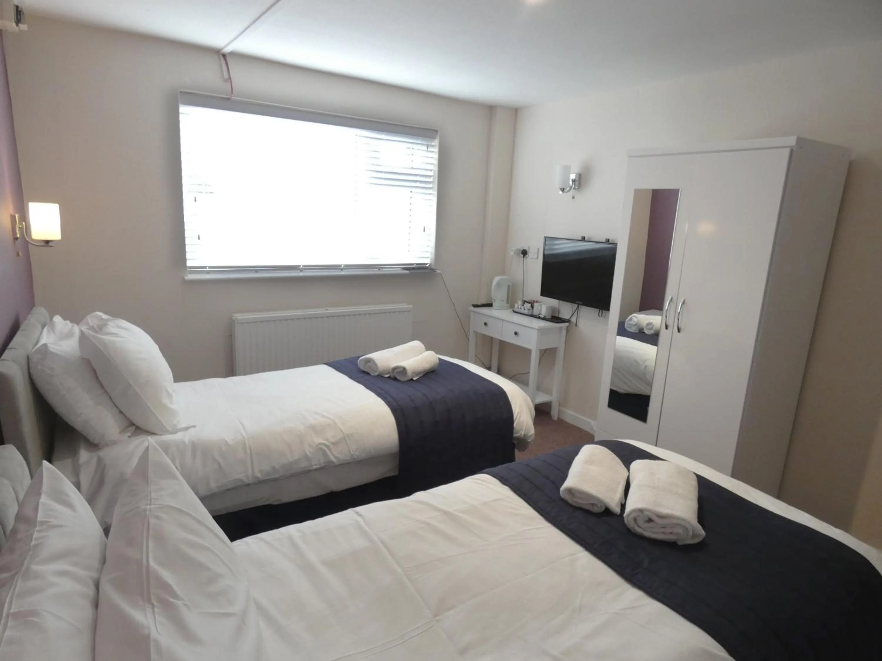 Bedroom in The Riverside Hotel