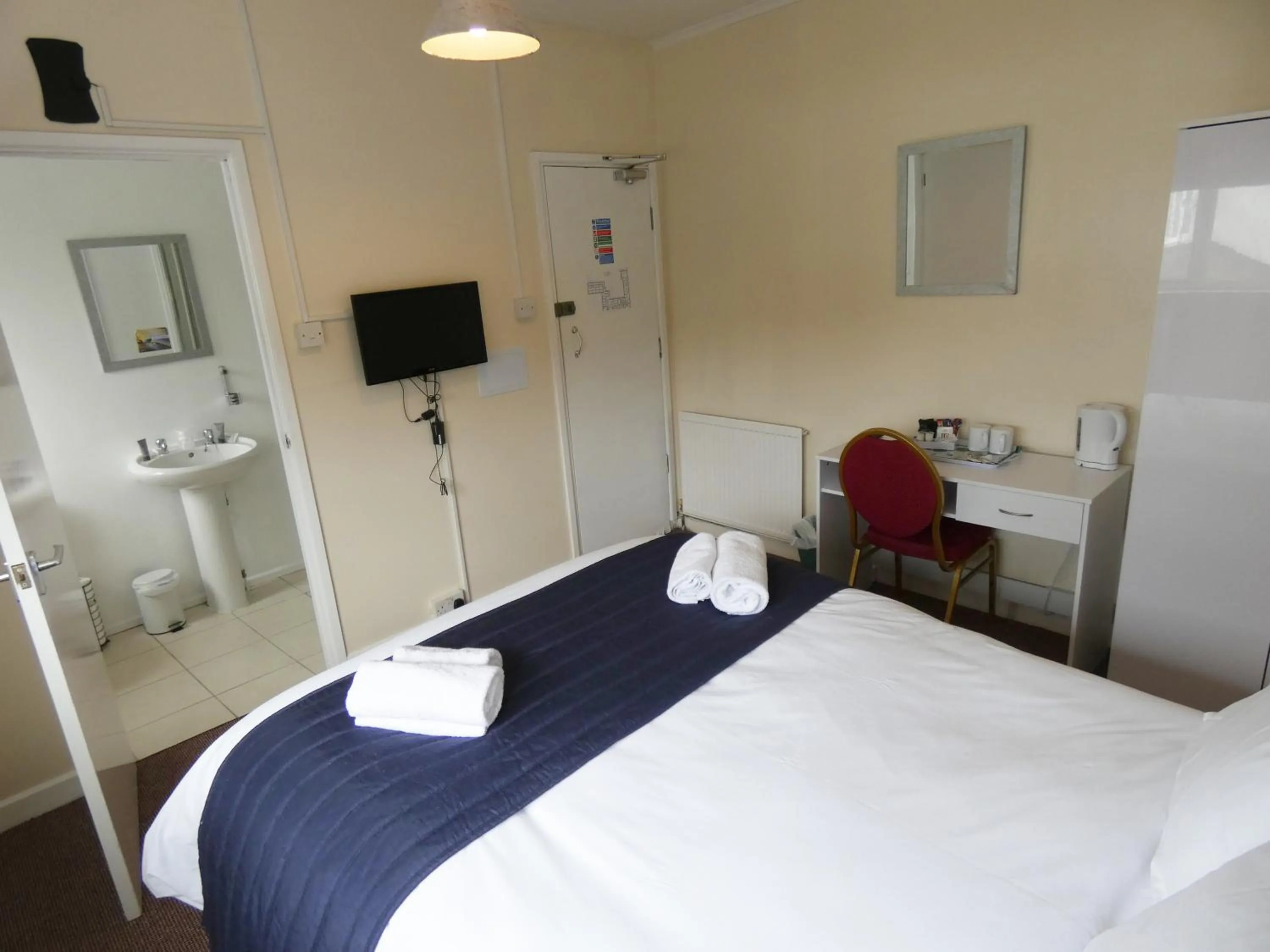 Bedroom in The Riverside Hotel