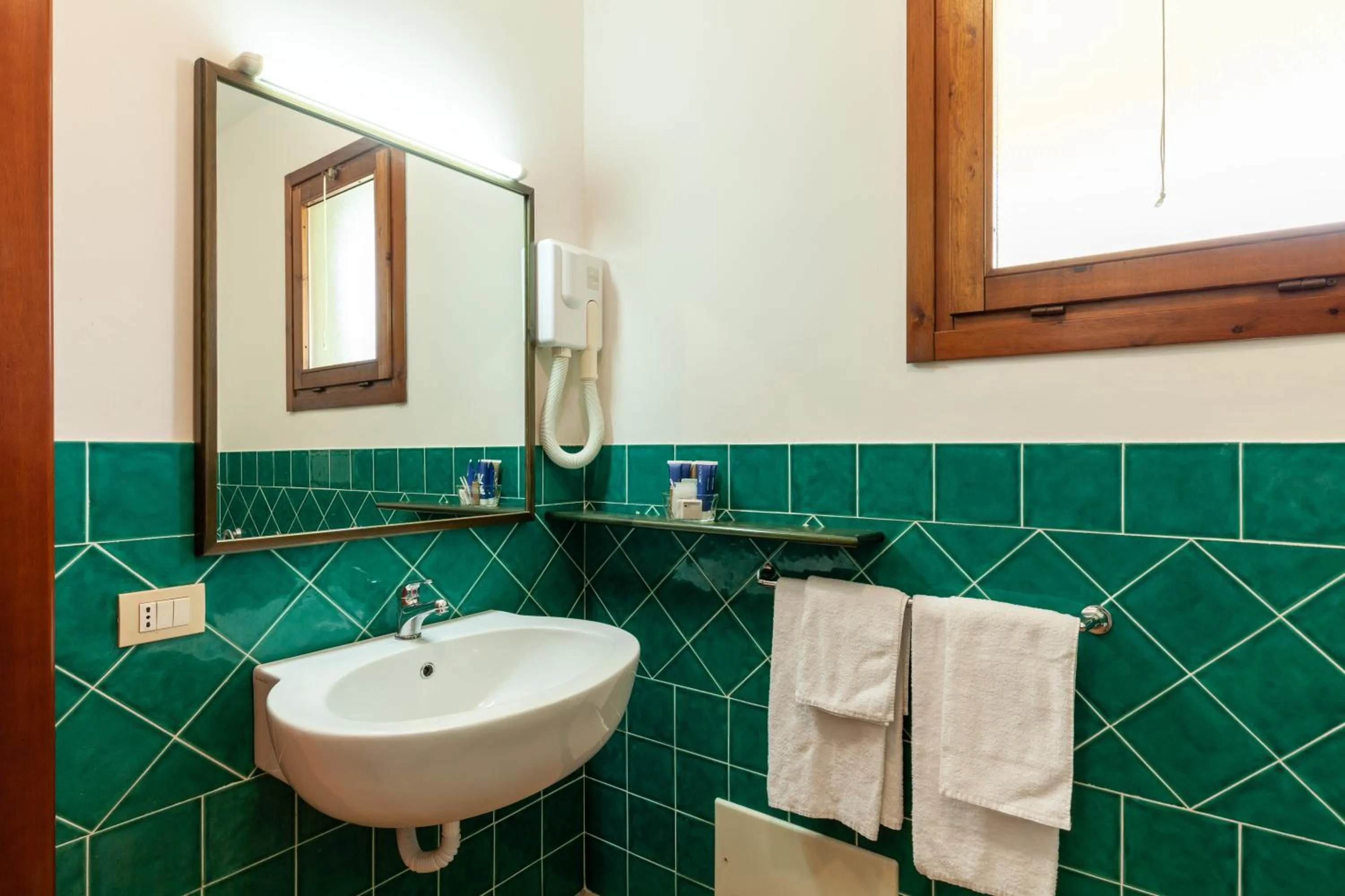 Bathroom in iH Hotels Le Zagare Resort