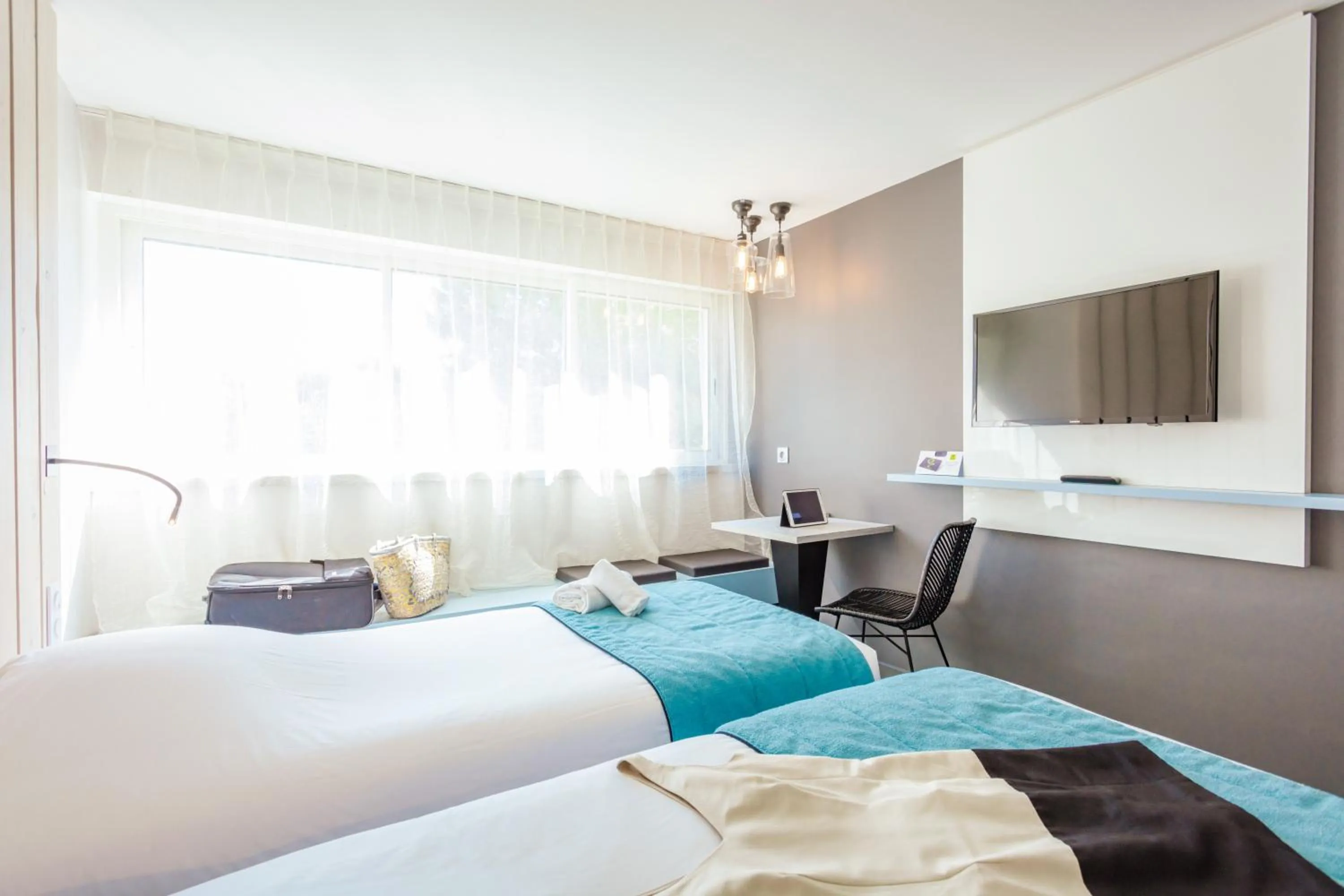 Photo of the whole room, Bed in Logis Hôtel Les Pins - Opéralia